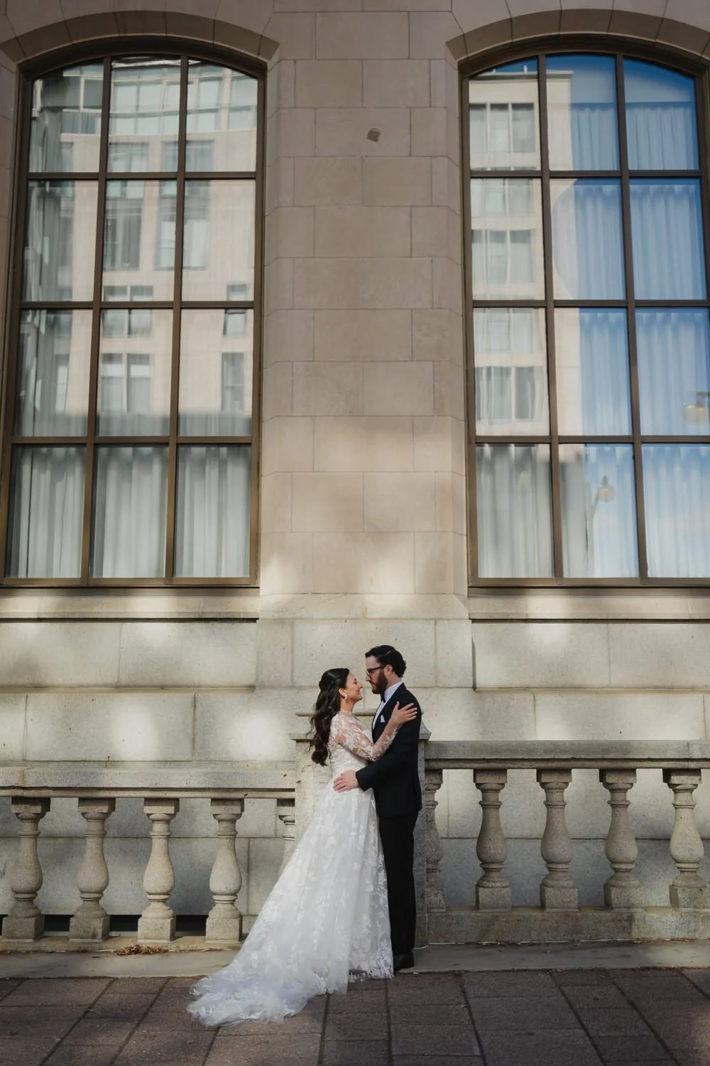 Portrait of a bride and groom outside of the Chateau Laurier