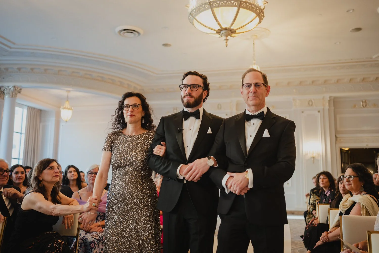 groom walking down the aisle in the drawing room at a chateau laurier wedding