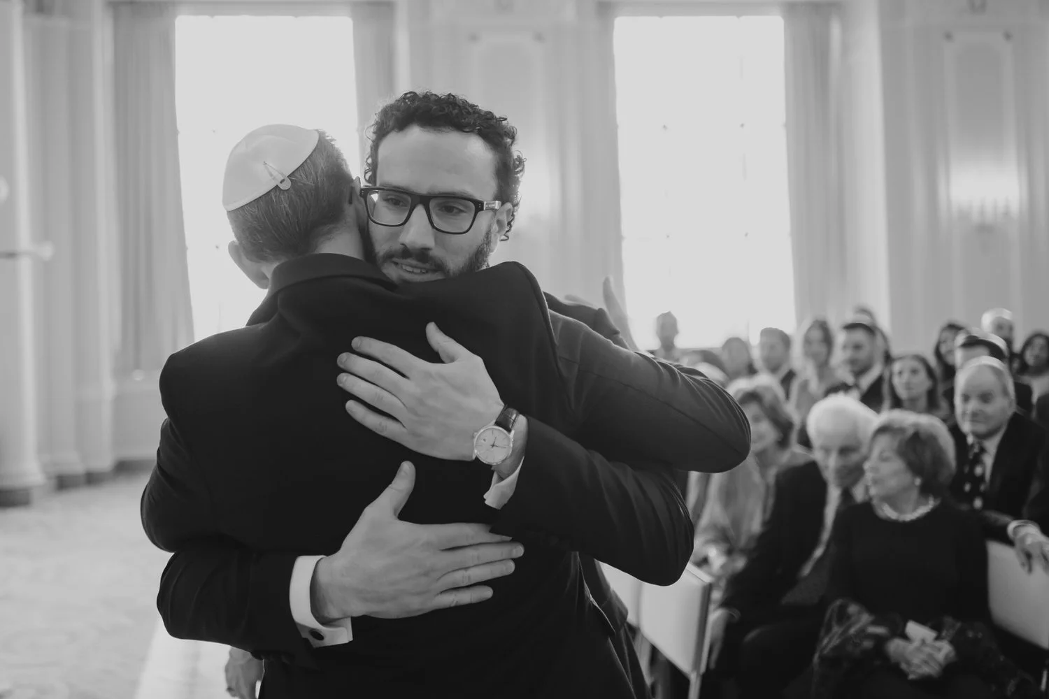 a groom hugging his father