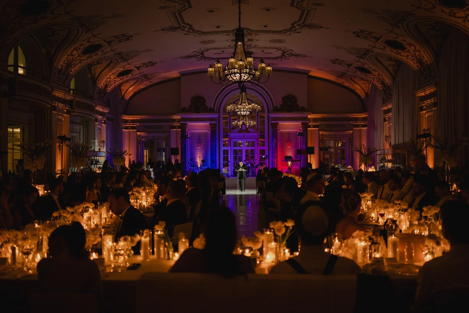 a wedding reception in the candle lit ball room at the chateau laurier