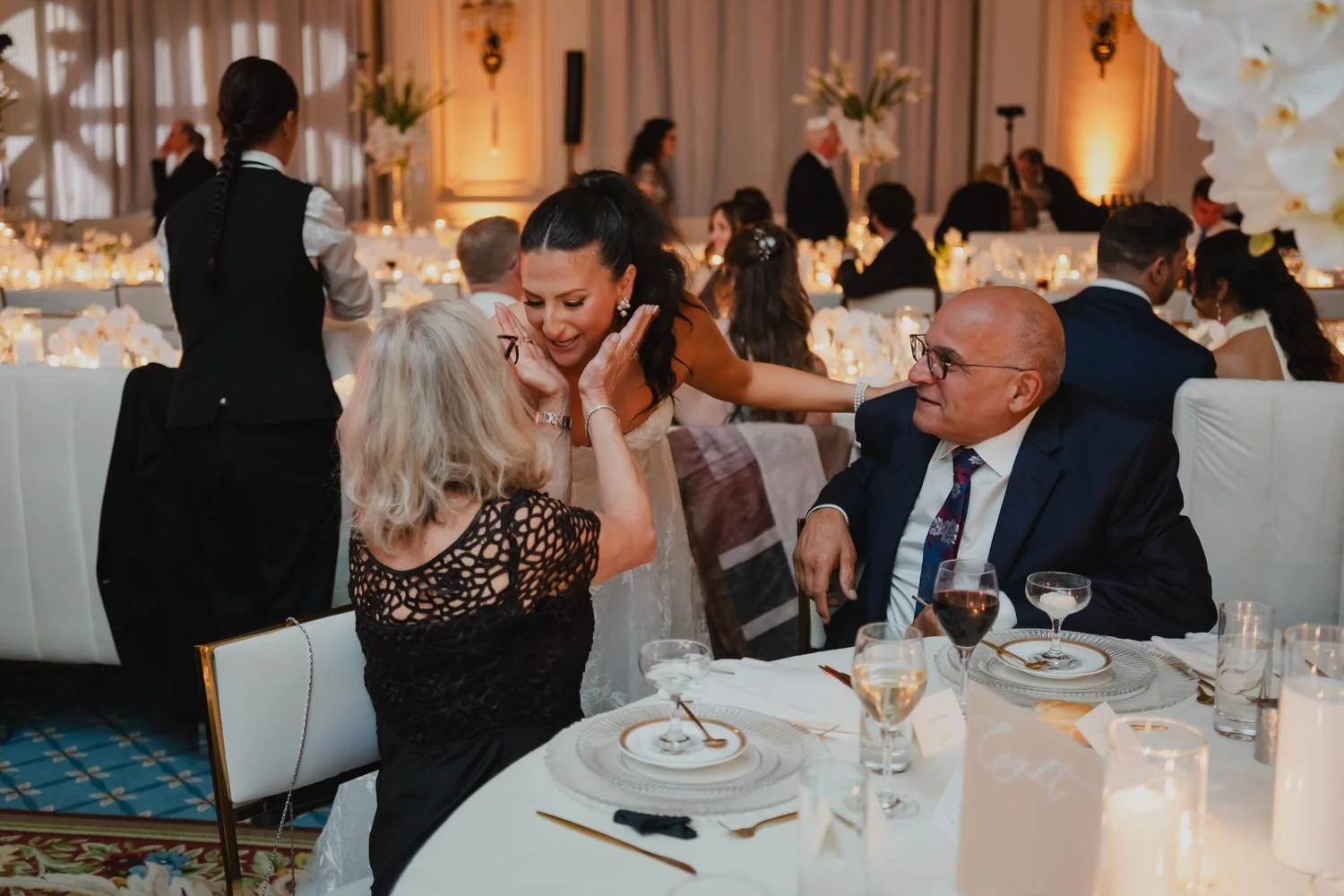 a wedding reception in the candle lit ball room at the chateau laurier