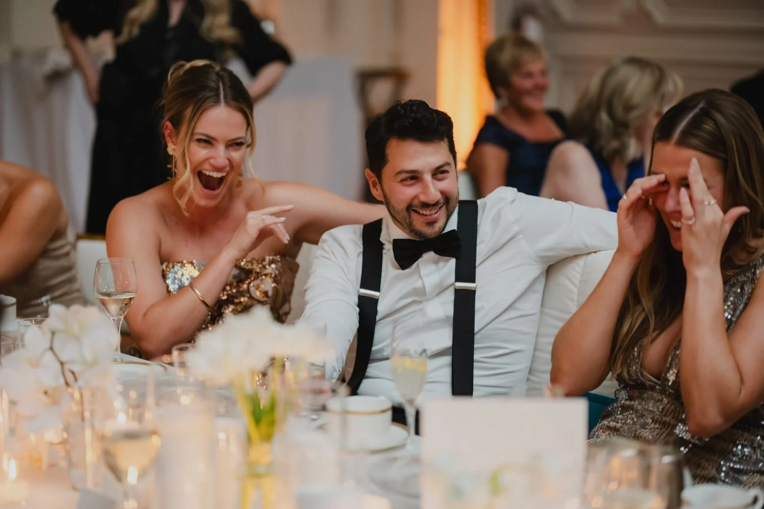 a wedding reception in the candle lit ball room at the chateau laurier