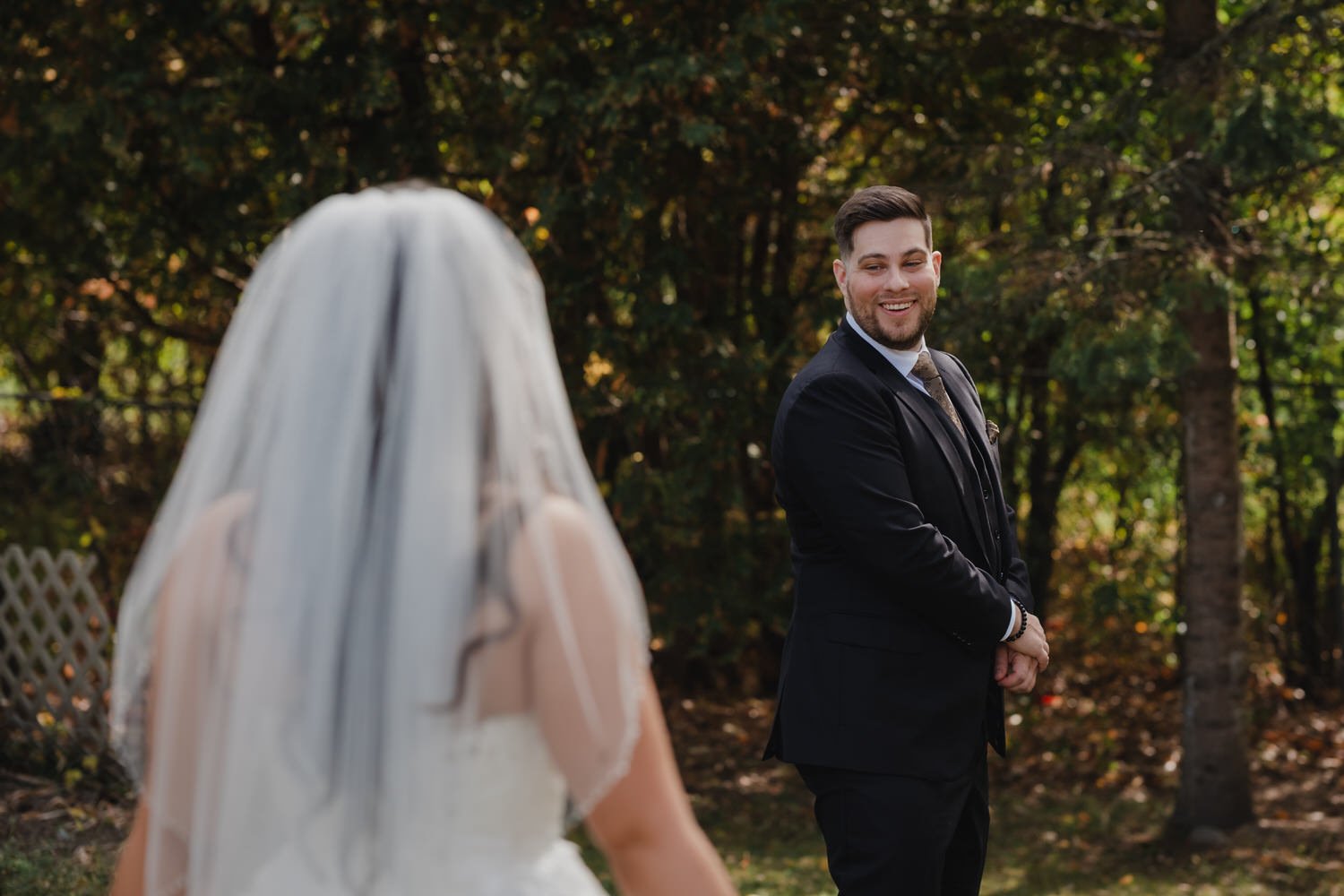 emotional first look photograph of a bride and groom on their wedding day 