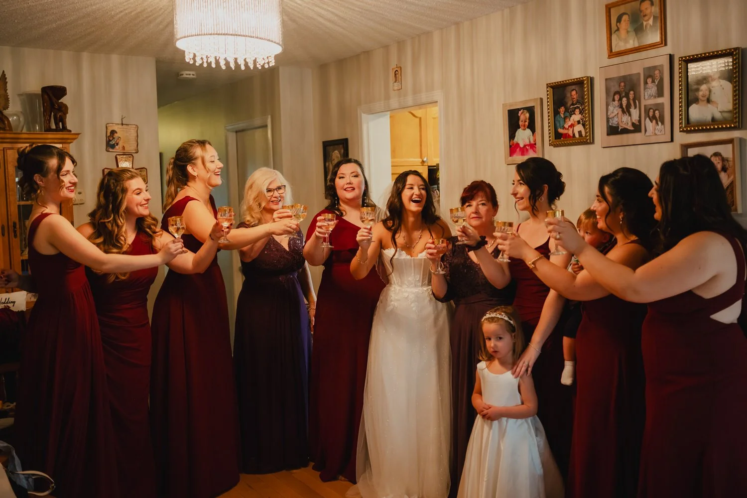 a bride and her bridesmaids have a cheers 