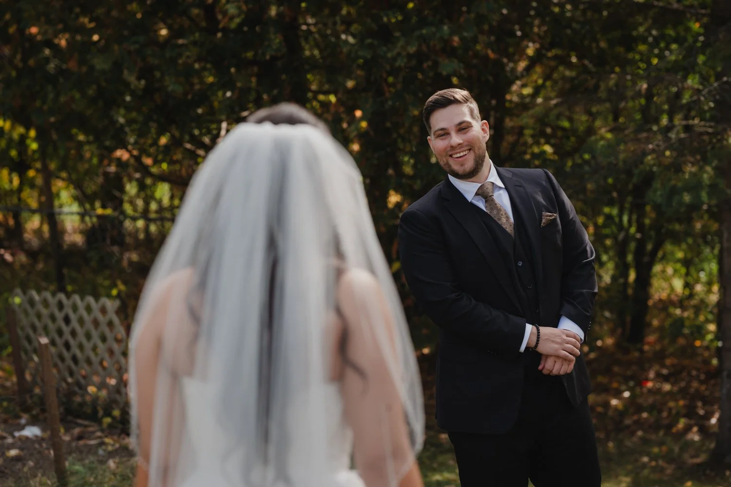 emotional first look photograph of a bride and groom on their wedding day 