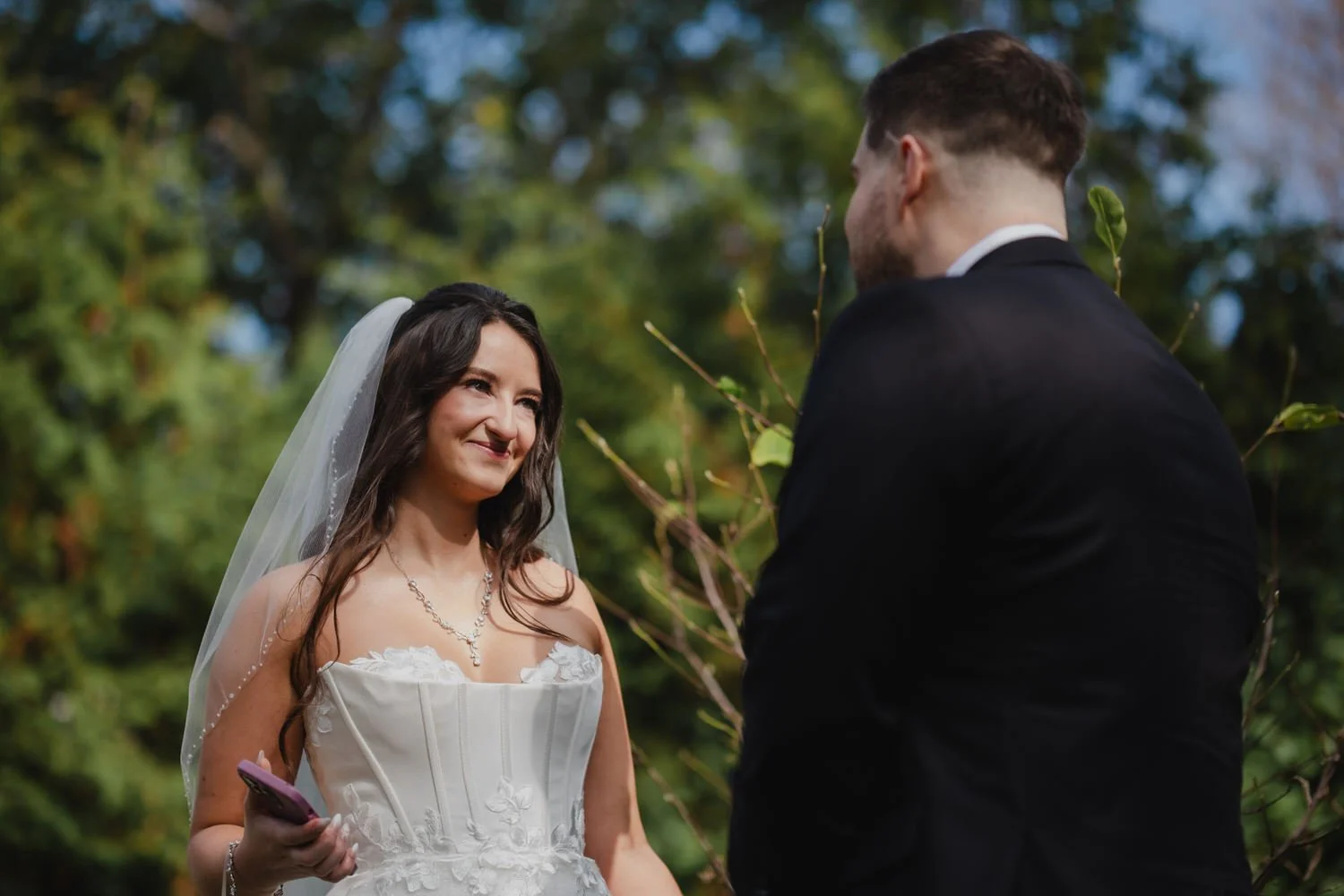 emotional first look photograph of a bride and groom on their wedding day 