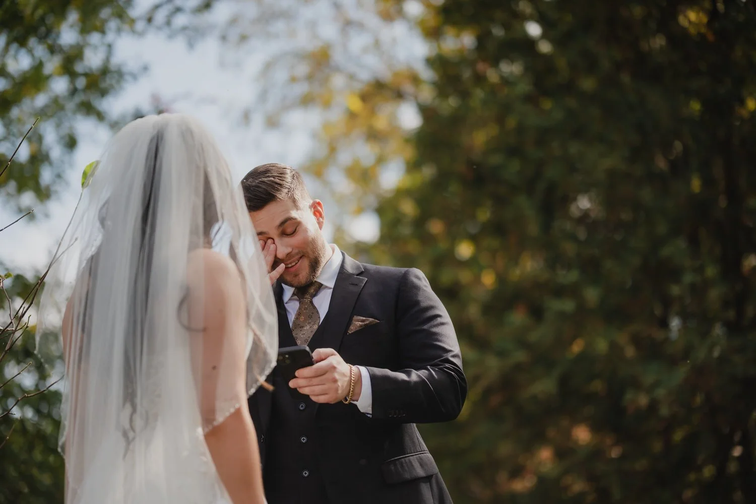 emotional first look photograph of a bride and groom on their wedding day 