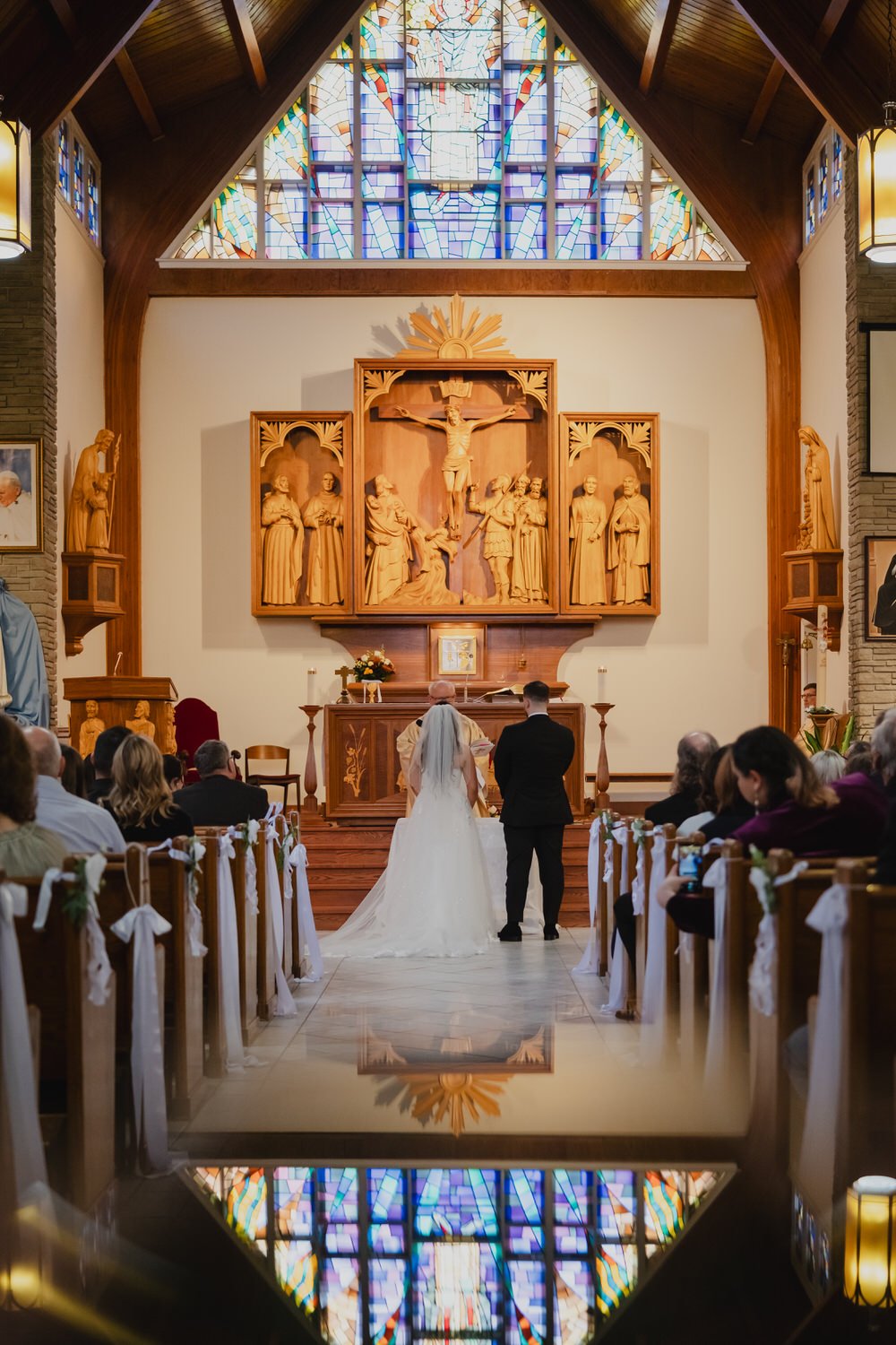 a wedding ceremony photograph in a traditional ottawa church