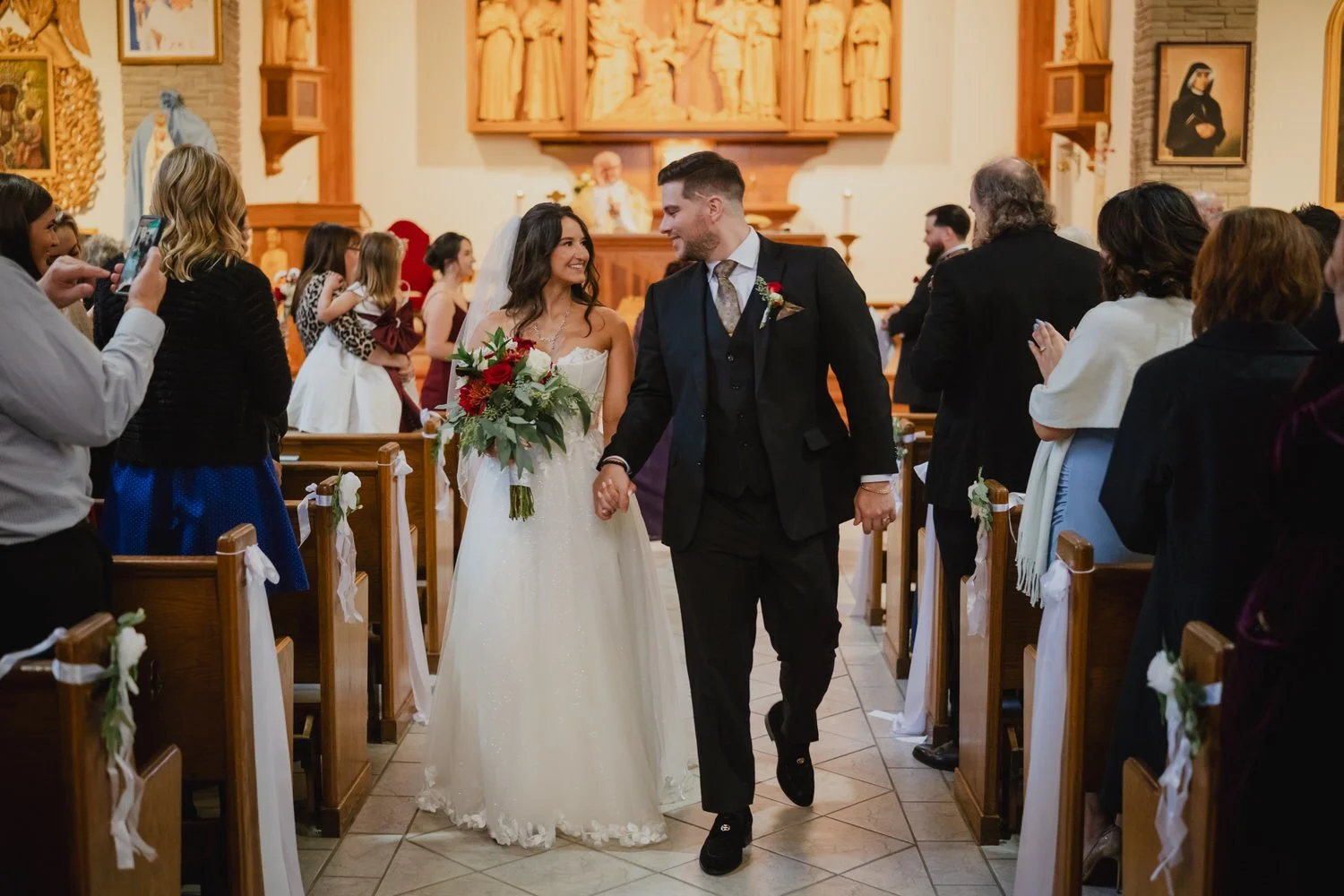a wedding ceremony photograph in a traditional ottawa church