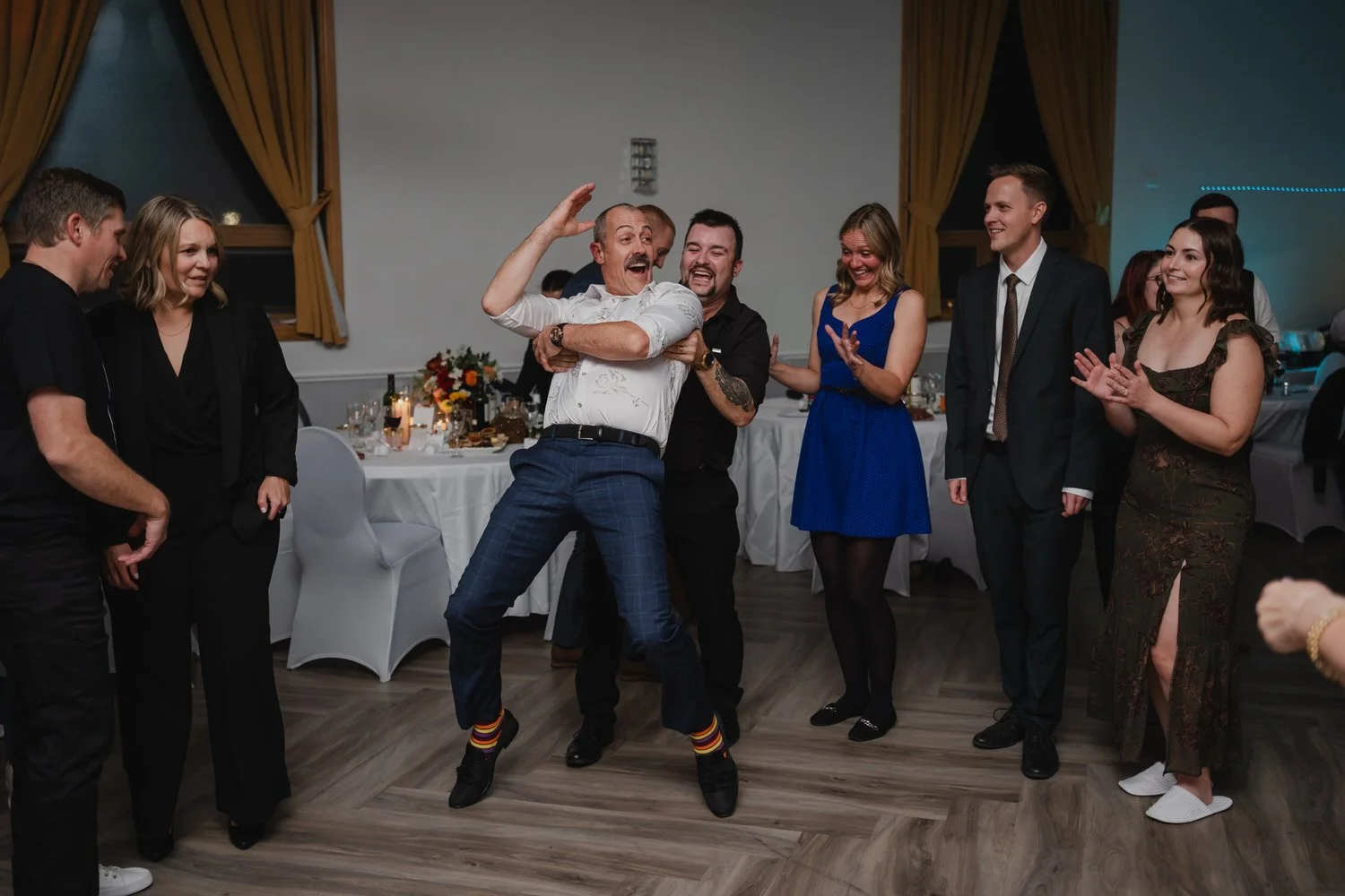 fun dancing photograph at a wedding reception