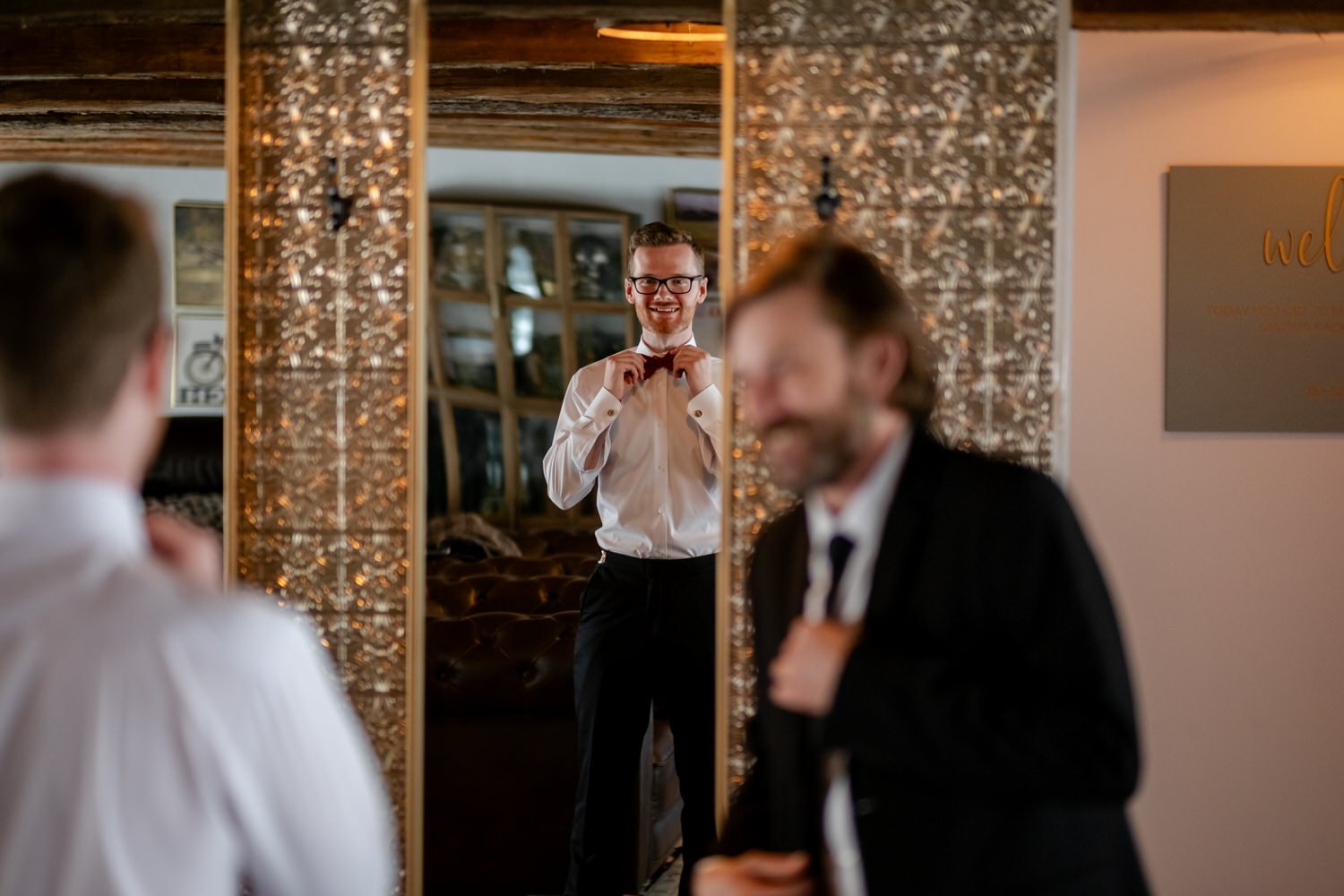 photo of a groom getting ready for his wedding at stonefields estate