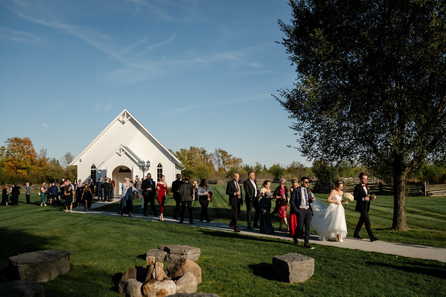 family members hugging a celebrating after a wedding ceremony