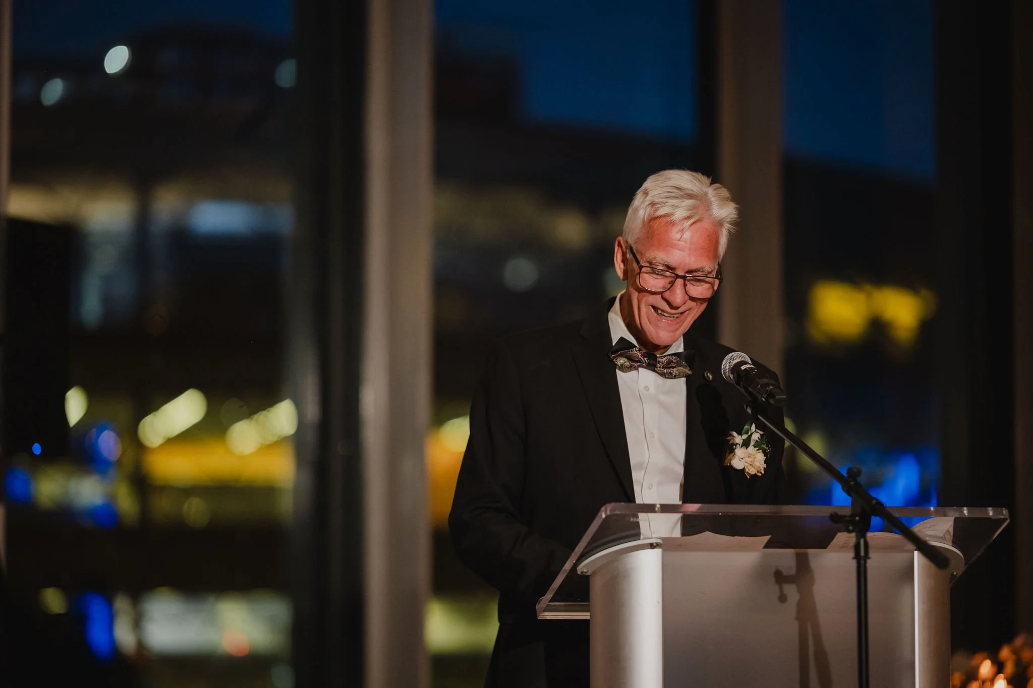 photo of someone giving a speech at a national arts centre wedding reception.