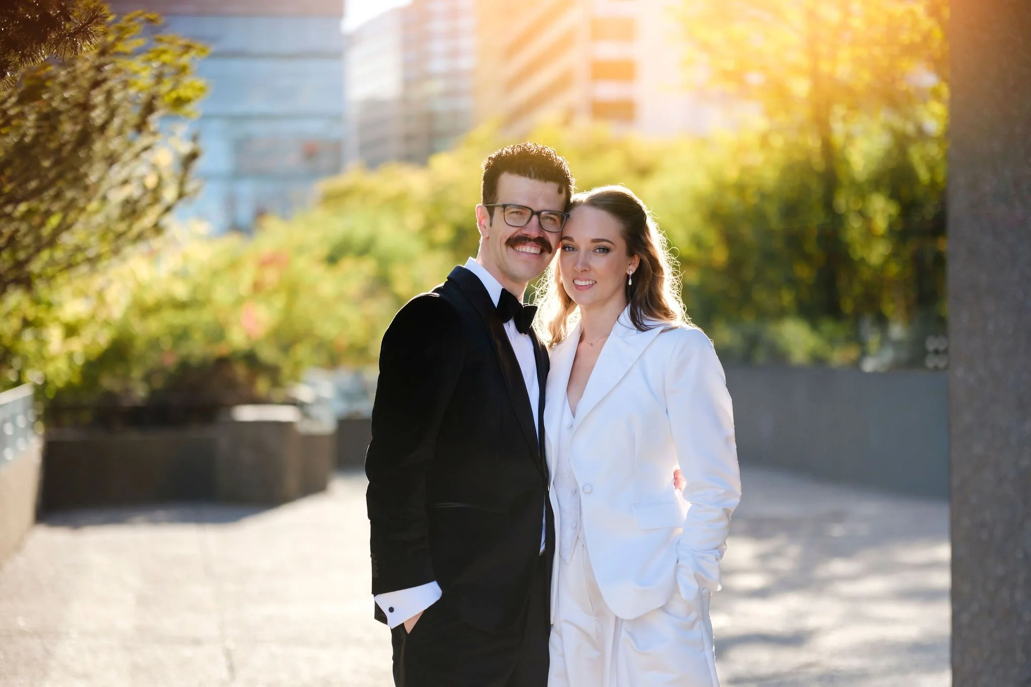 soft, sunset photograph of a bride in groom outside the NAC in ottawa