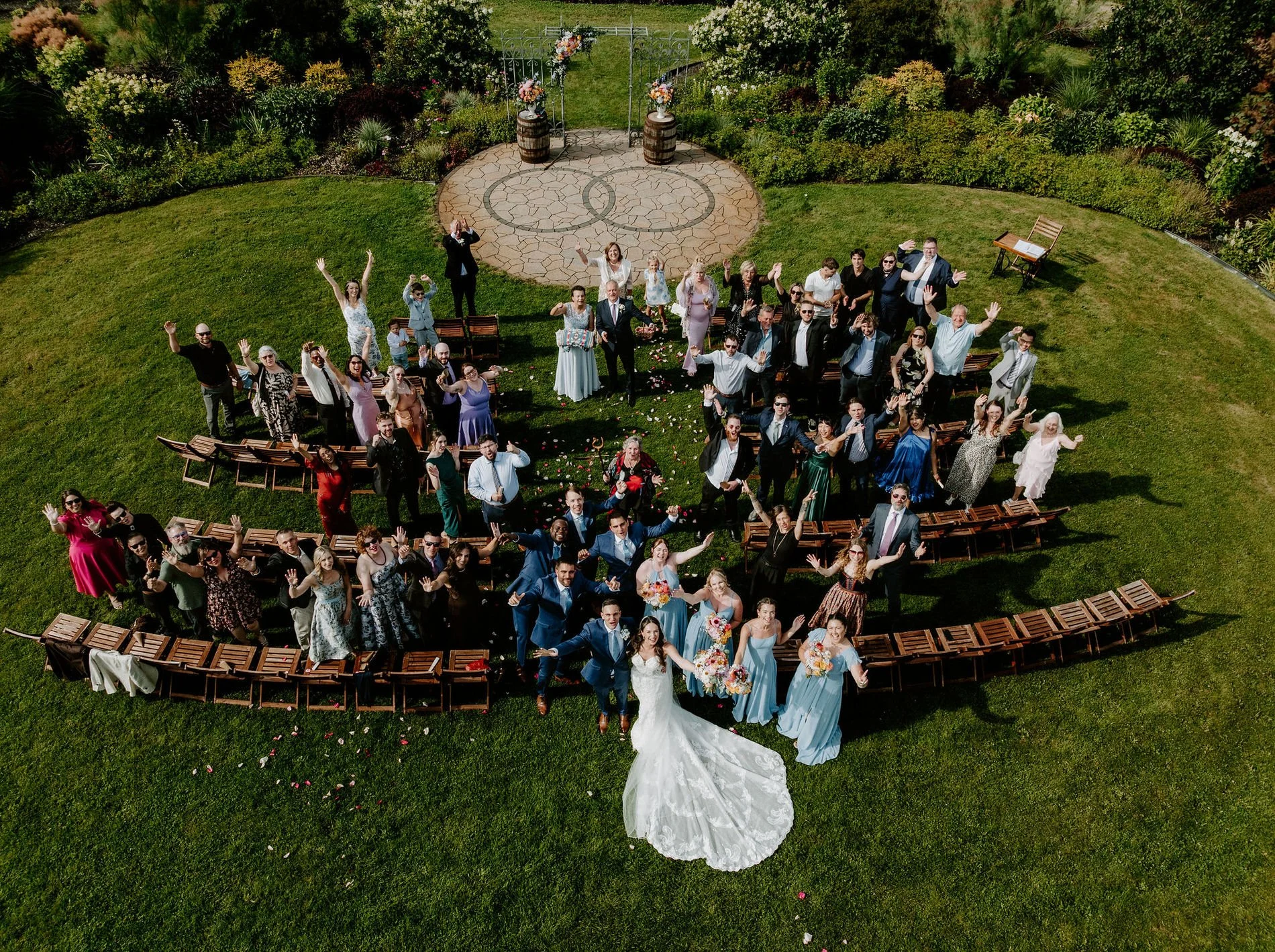 Aerial view of Holly, Petar and their cheering guests around the circular ceremony space at Evermore, Ottawa