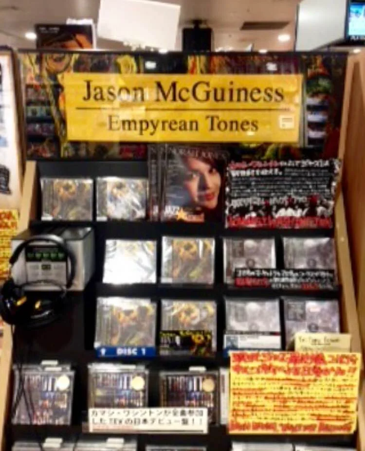 The CD on the shelves of Tower reords in Tokyo (next to the Kamasi Washington album, an artist who is also featured on Jason's album).