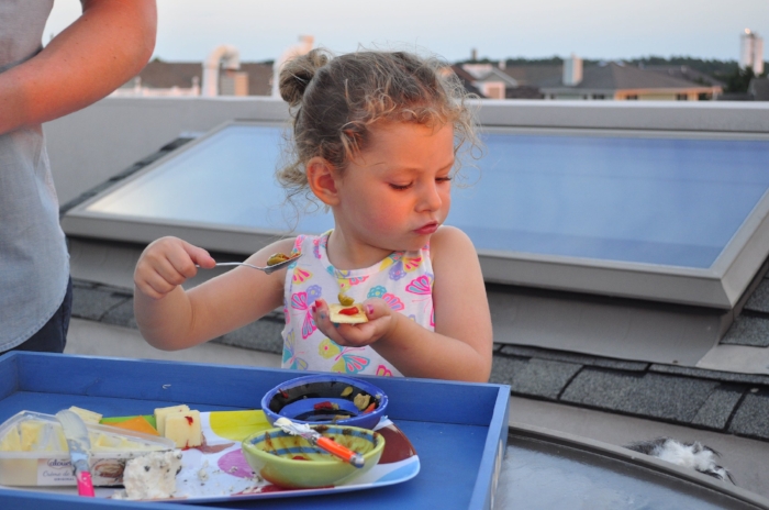 she was obsessed with putting olives on her crackers...and trying to keep it away from the dogs.