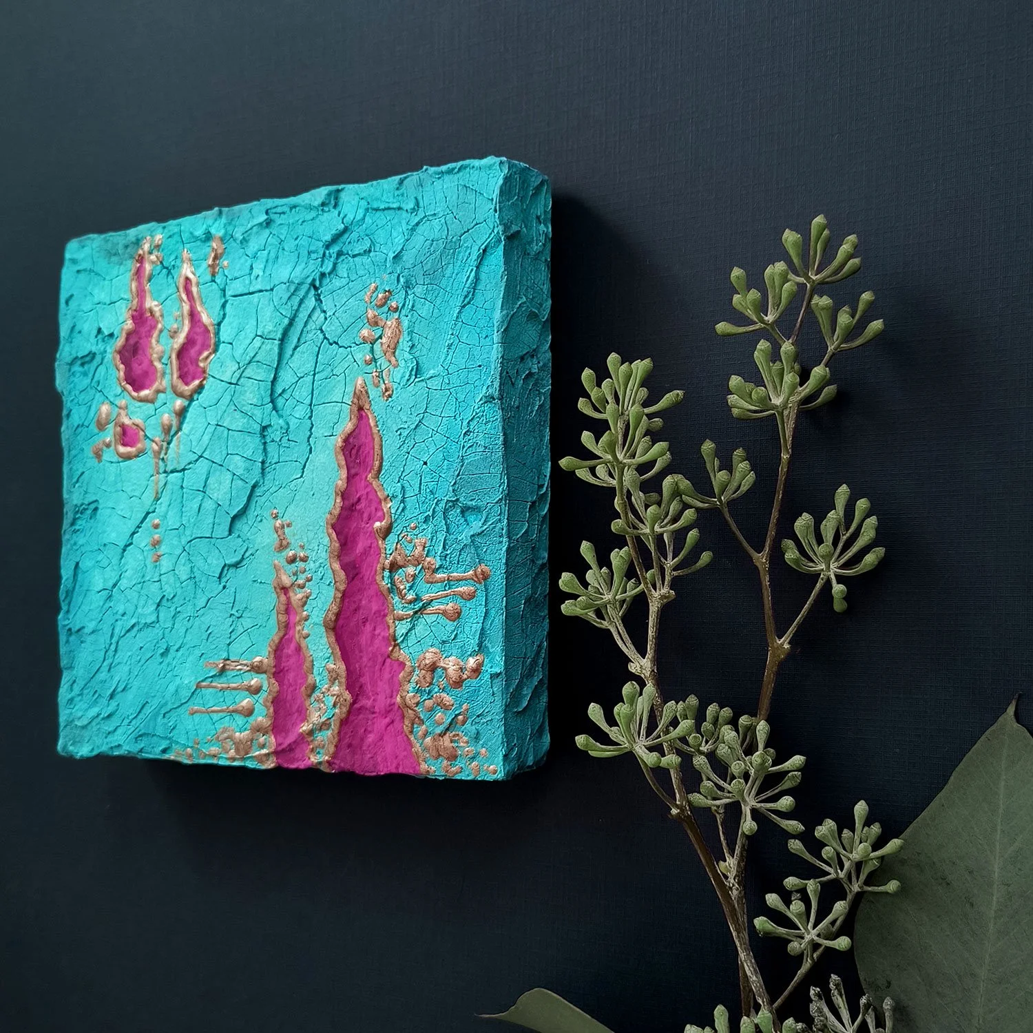 Side view of abstract painting crackle texture and raised details. Blue and pink. Titled Achernar. By Stacey Taylor.