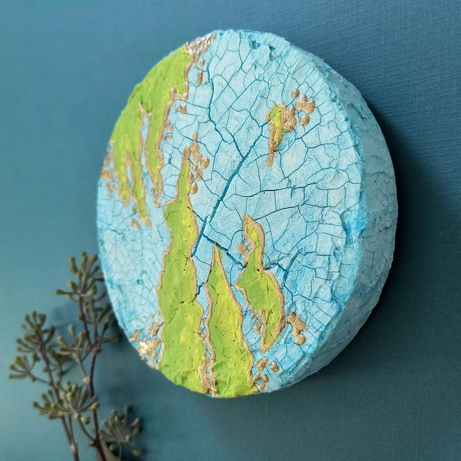 Side view of abstract painting crackle texture and raised details. Blue and green. Titled Arion. By Stacey Taylor.
