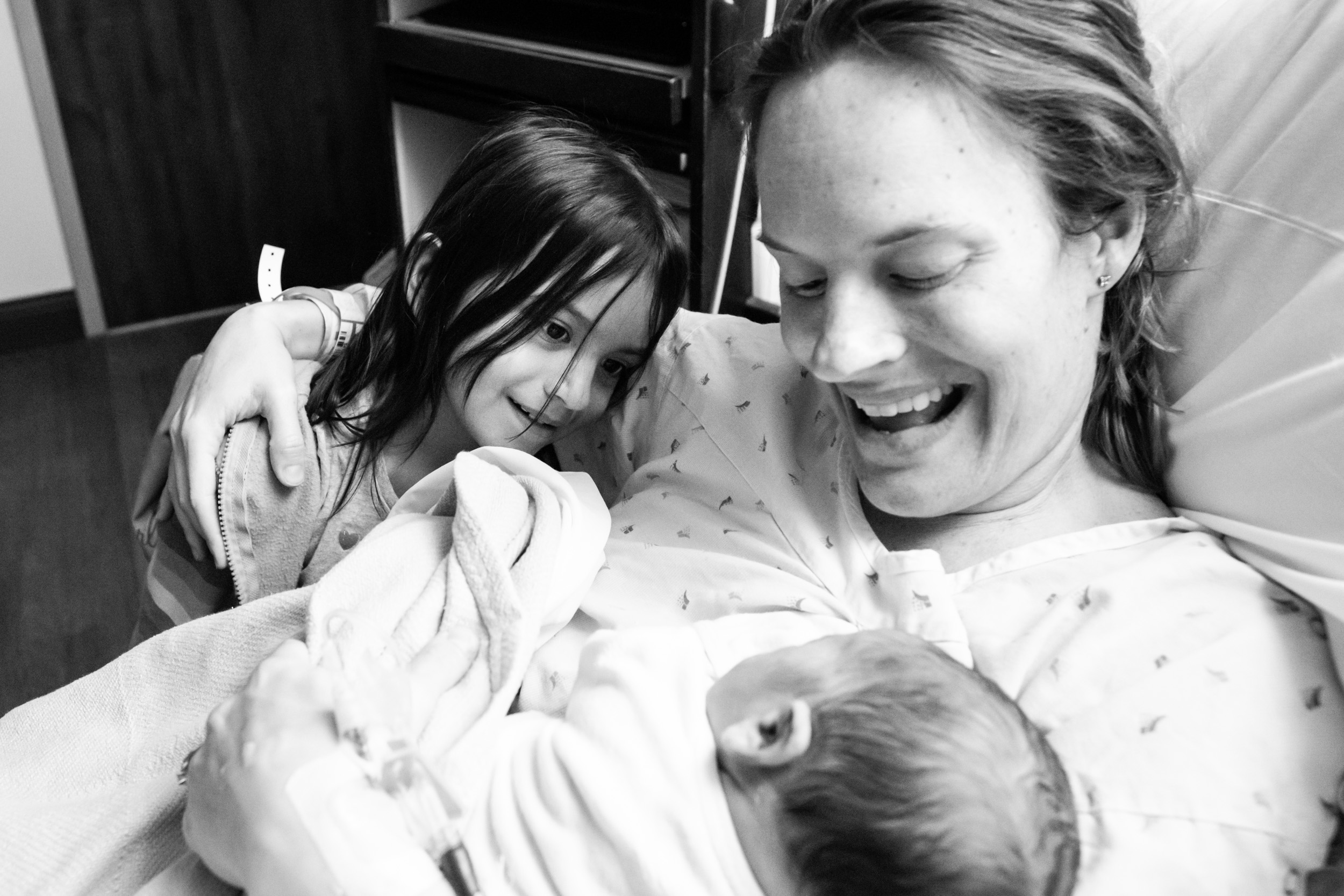 big sister meeting newborn baby brother