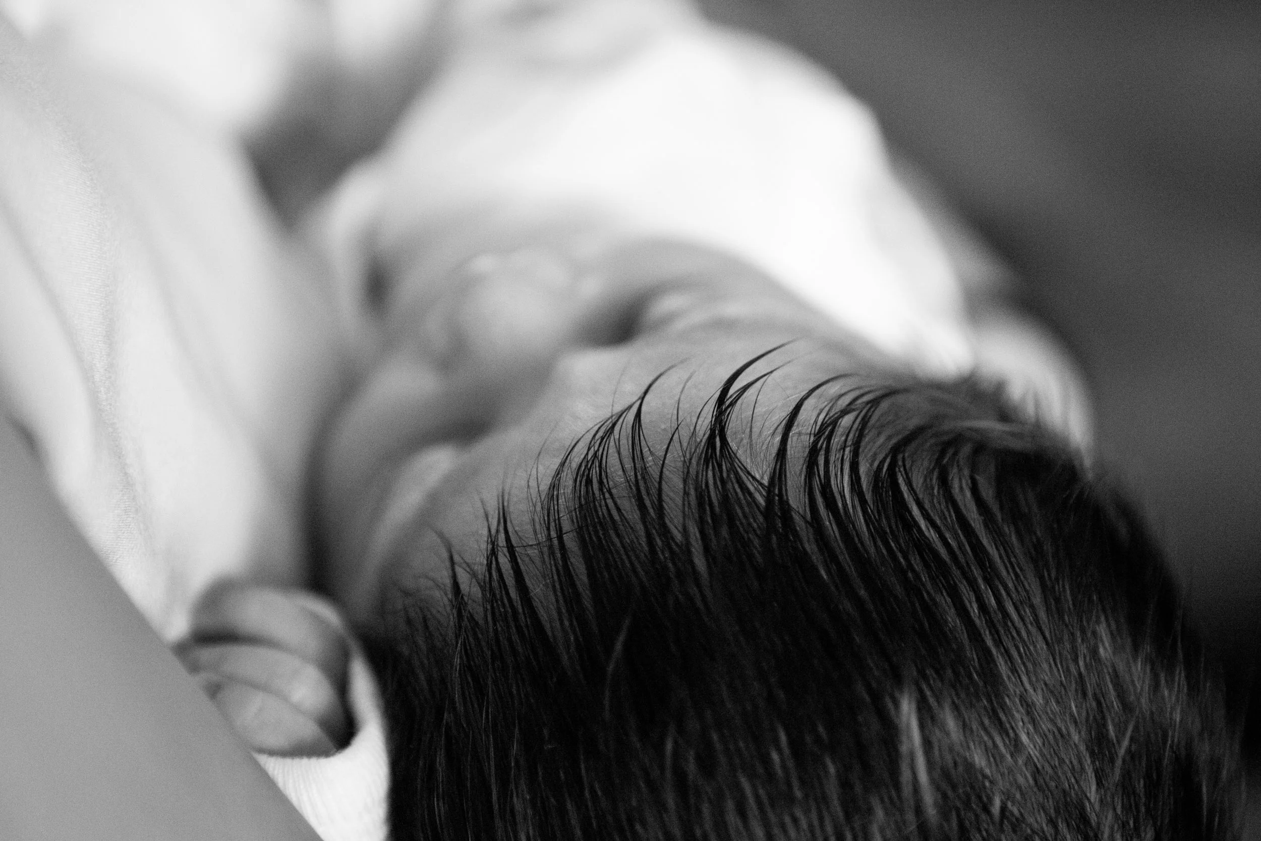 newborn baby closeup shot of details in hair