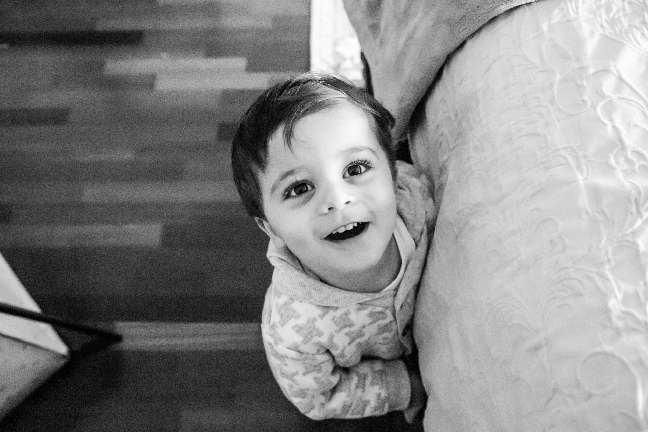 little boy looking up at camera and smiling