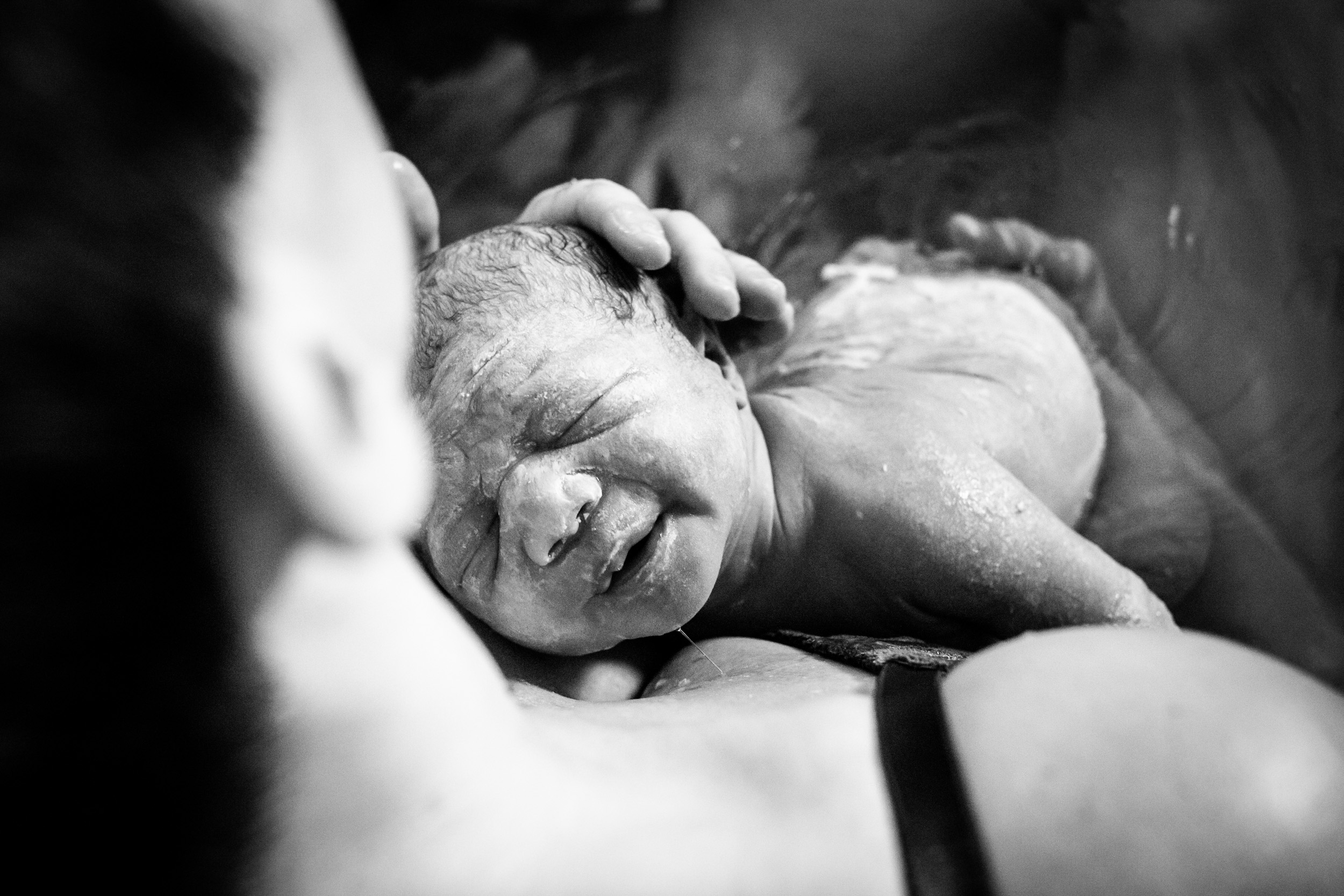 mom holding newborn baby
