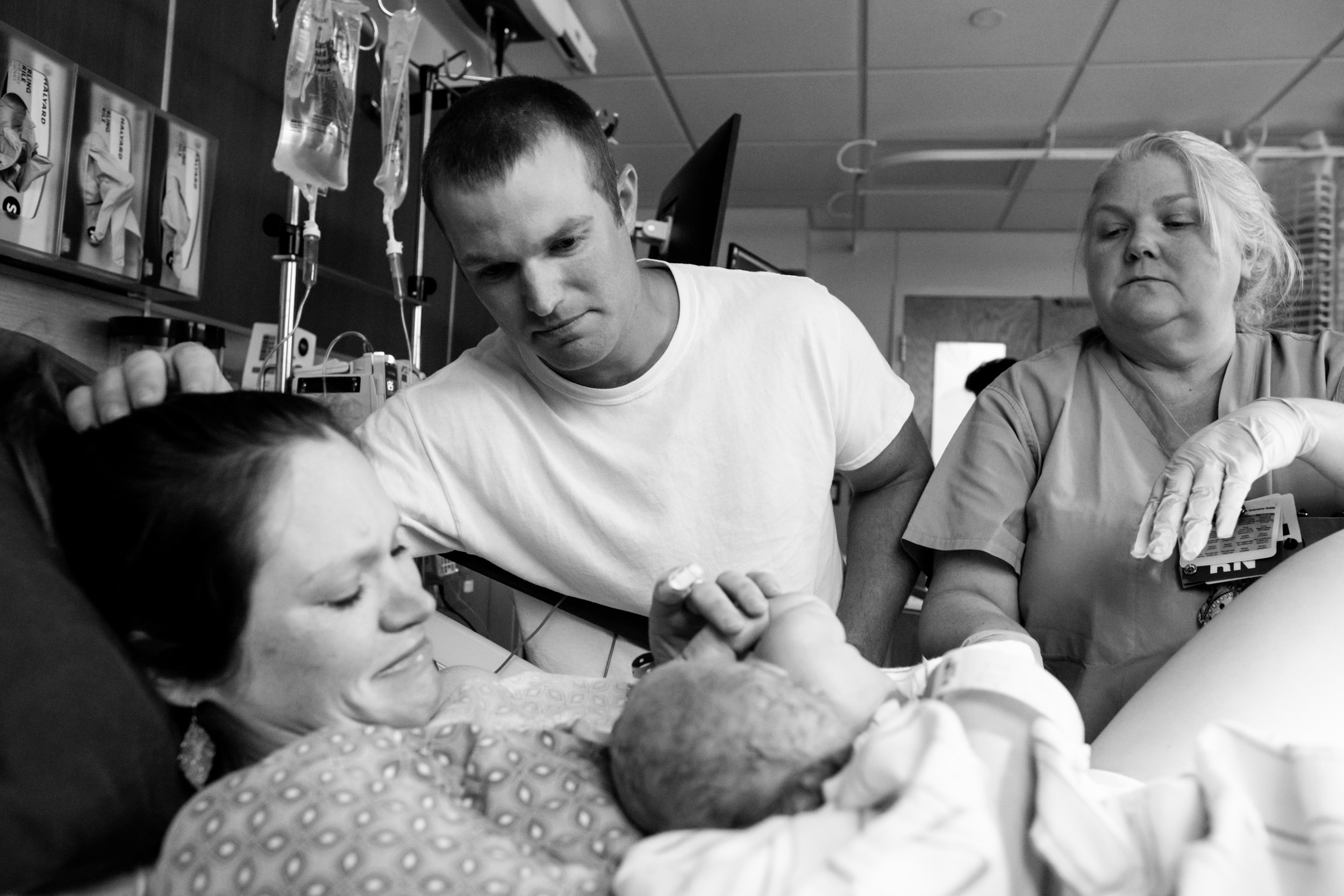 gainesville parents admiring their newborn son