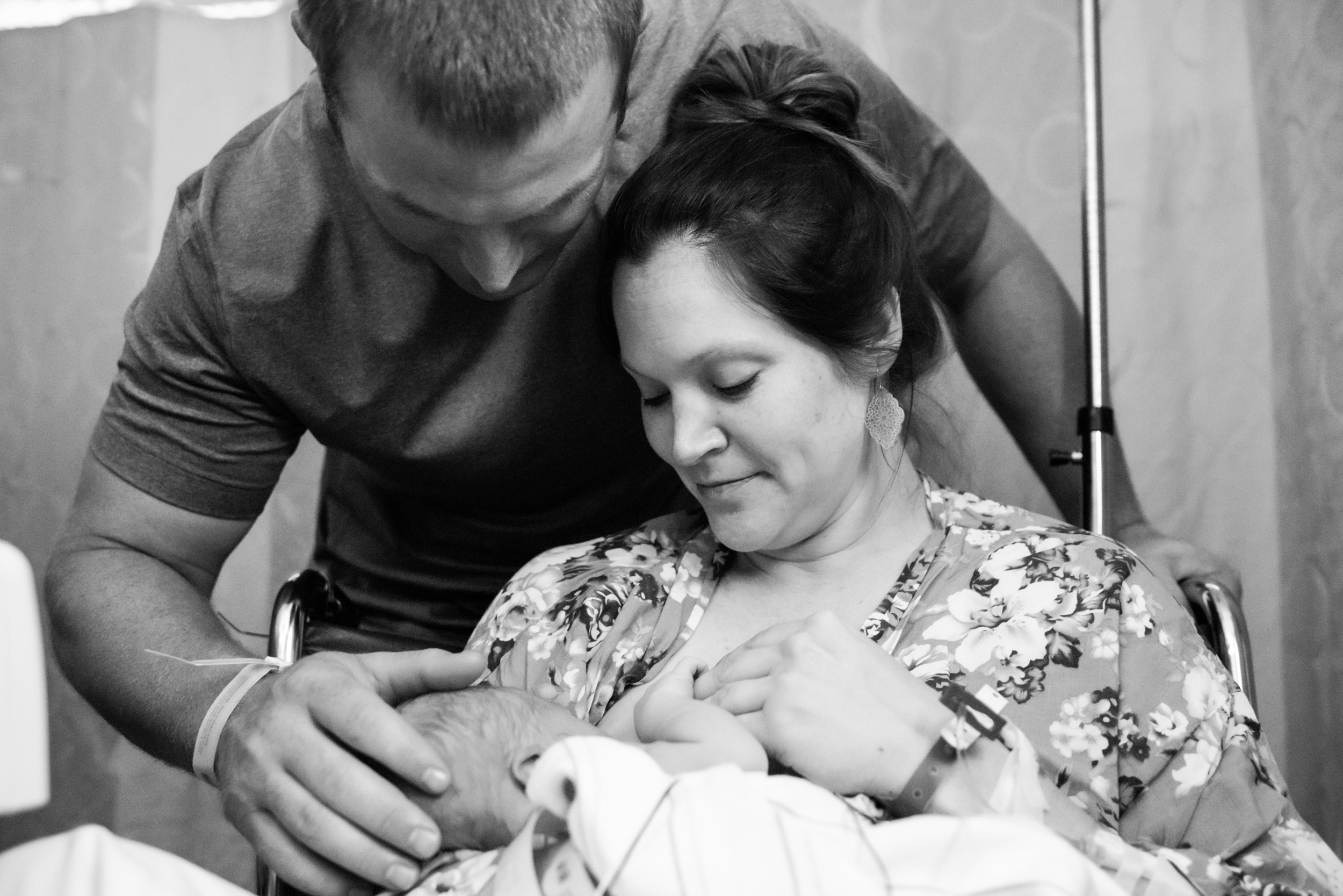 gainesville mom and dad admiring their sweet newborn baby during his short stay in the nicu
