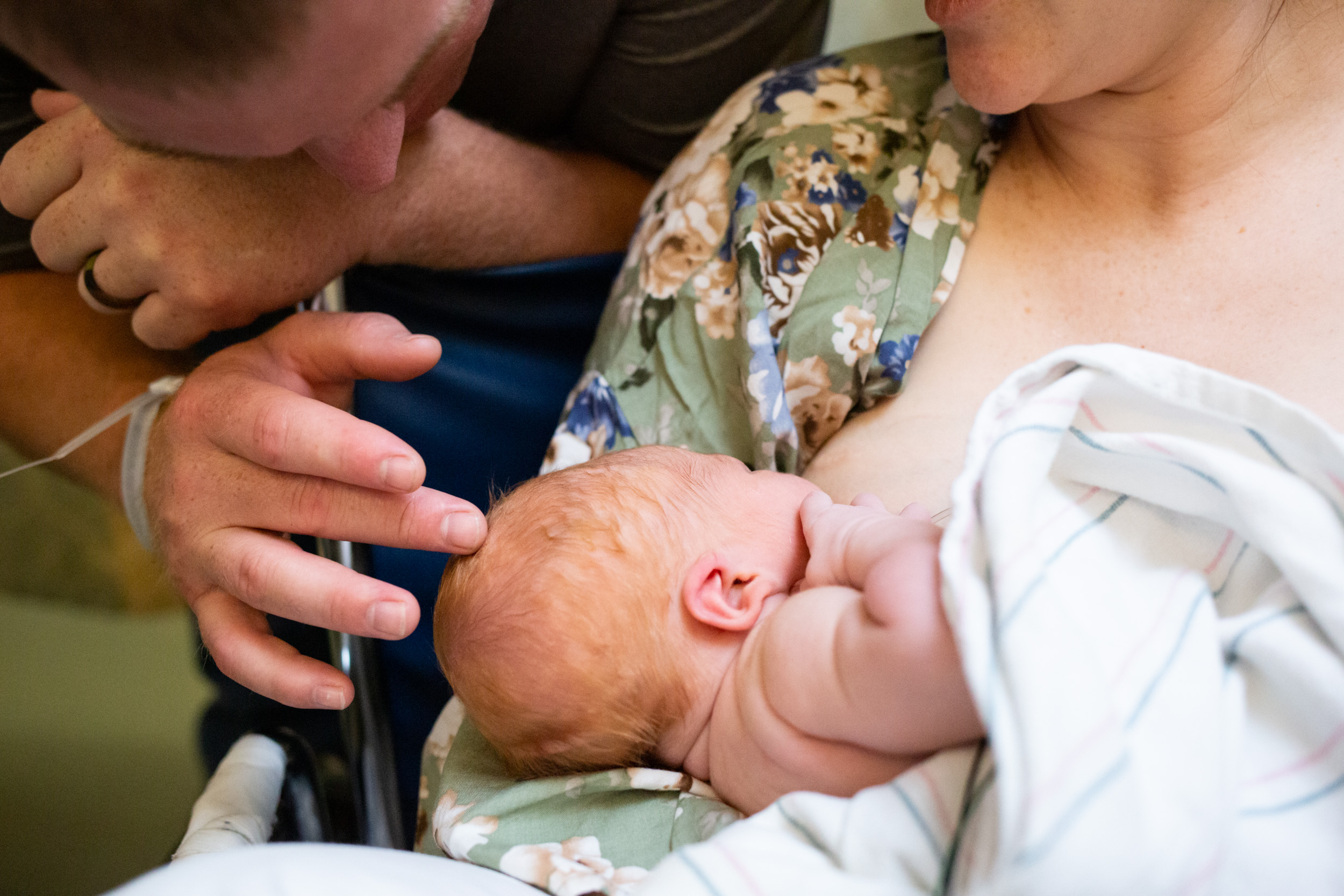 gainesville dad gently touching newborn's head