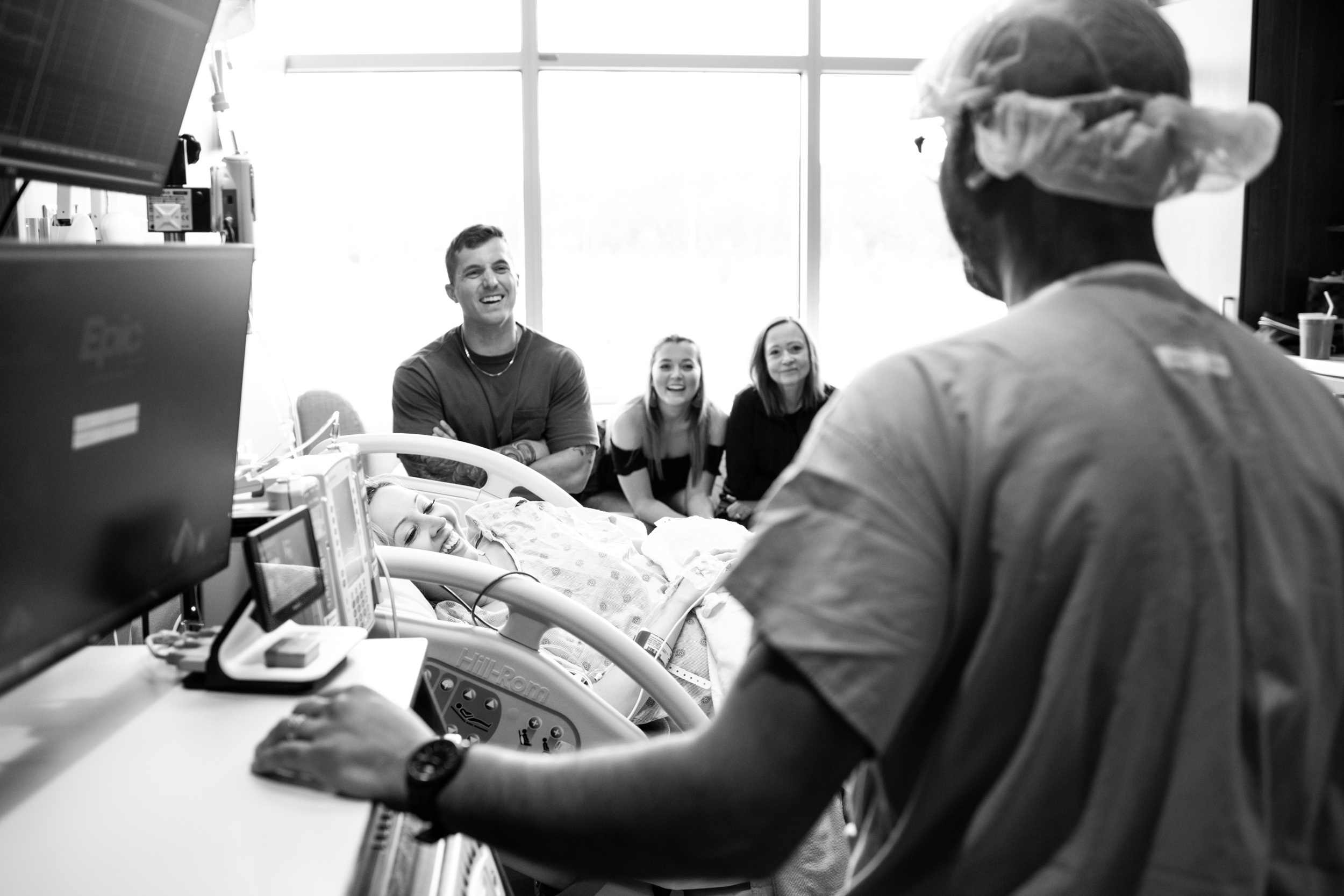 anesthesiologist talking to birth mom and family