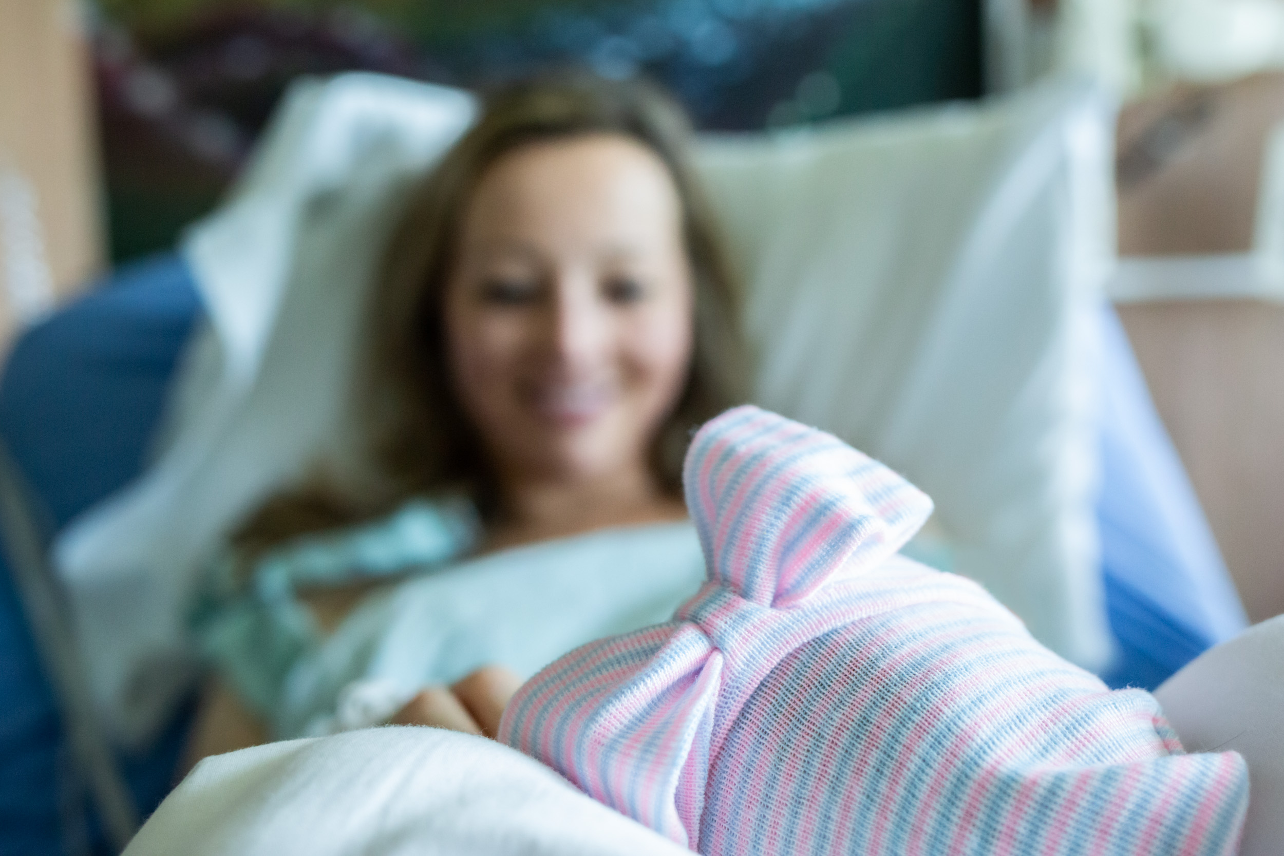 jacksonville birth mom looking at newborn baby girl