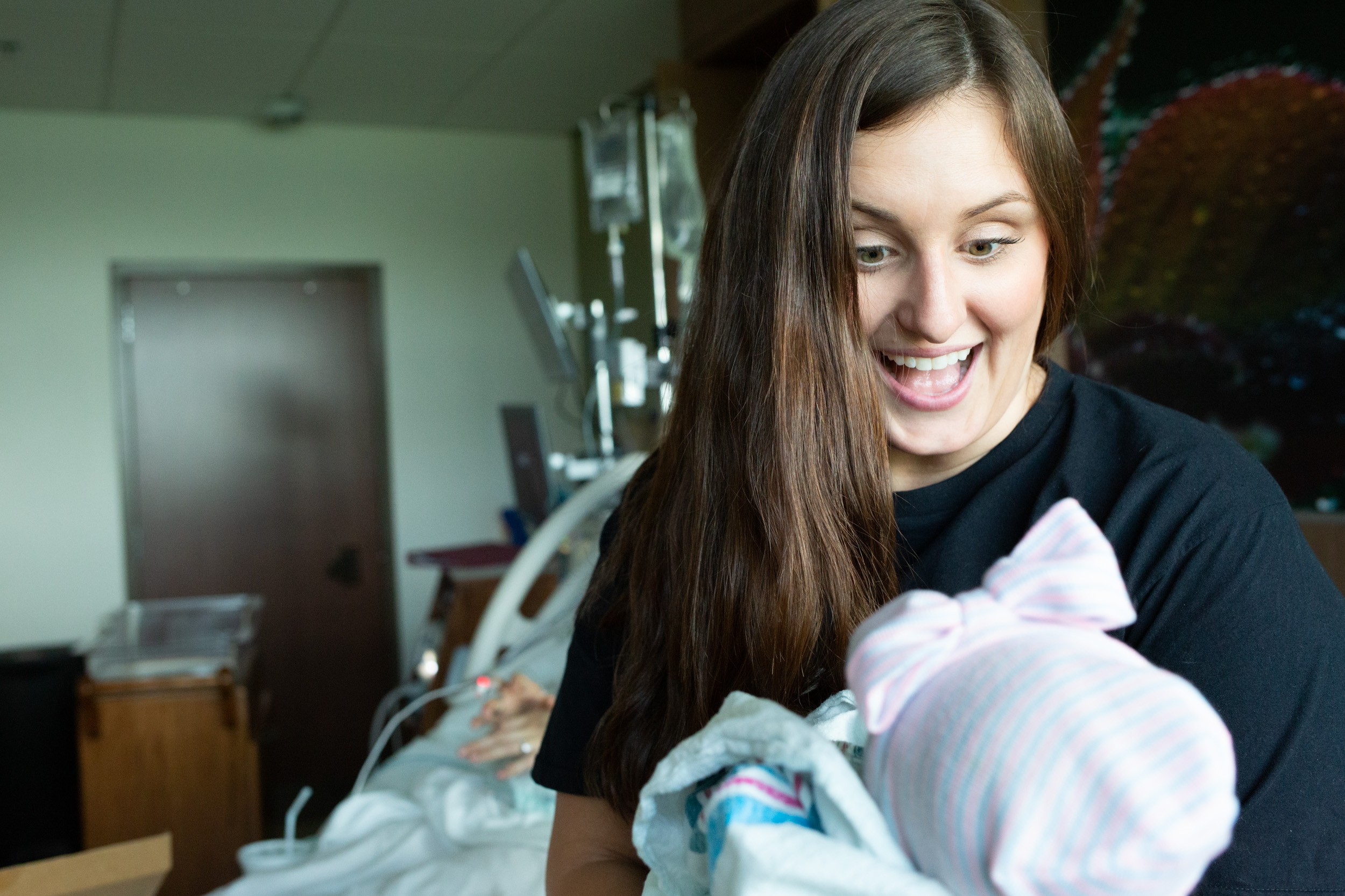 jacksonville doula holding newborn baby girl