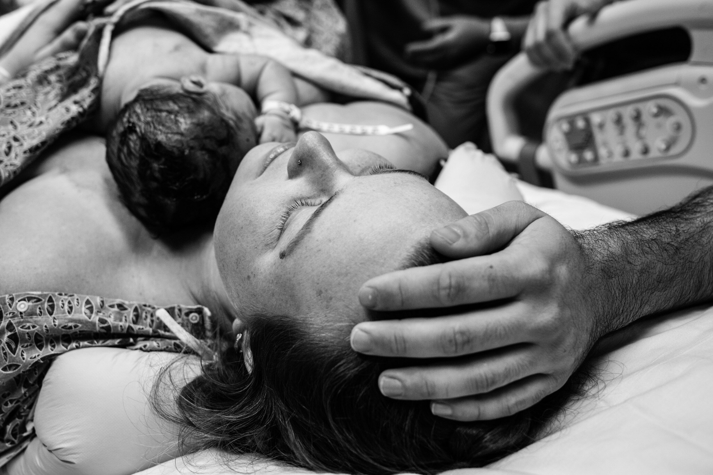 dad with his hand on his head after baby was born