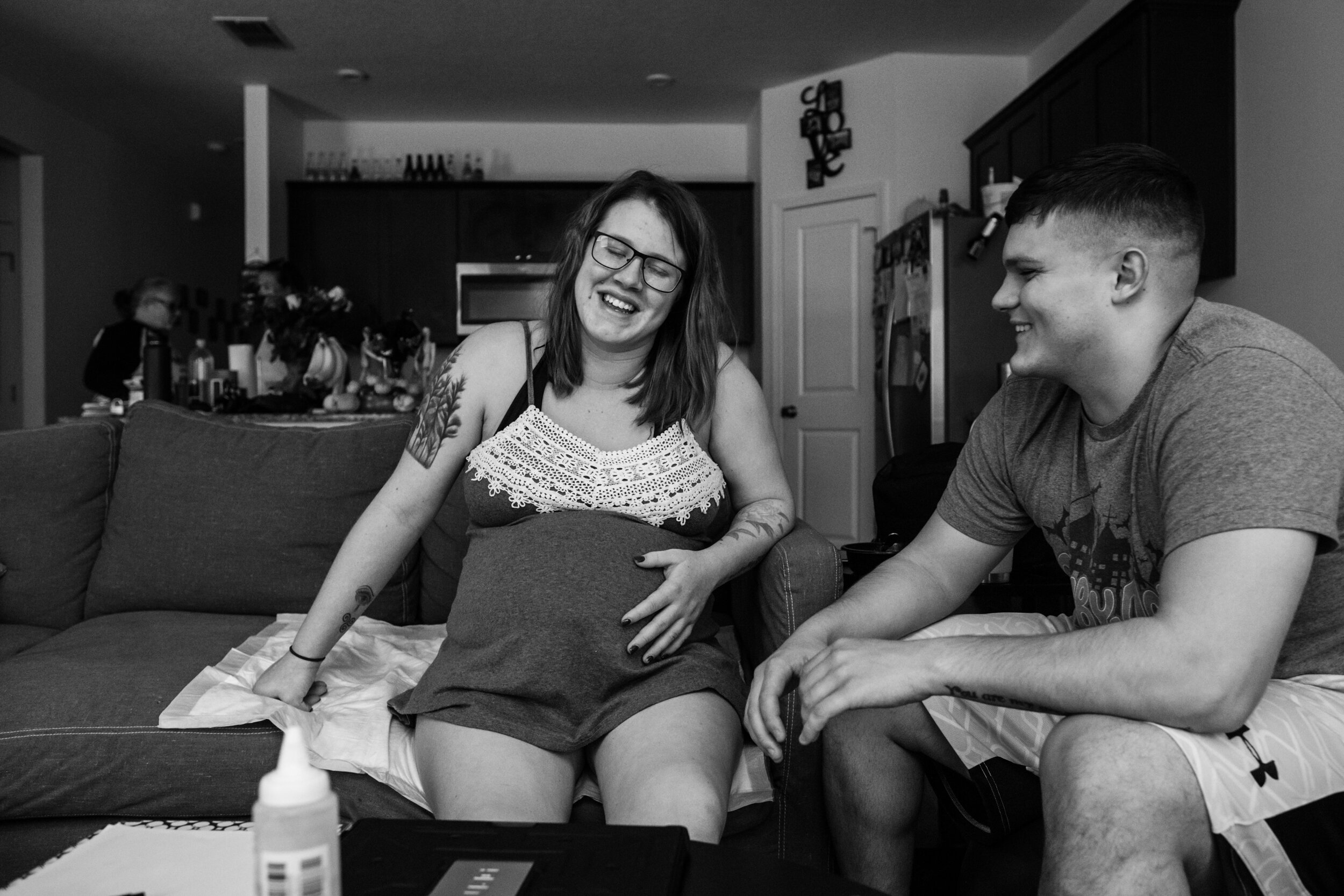 pregnant mom laughing in between contractions