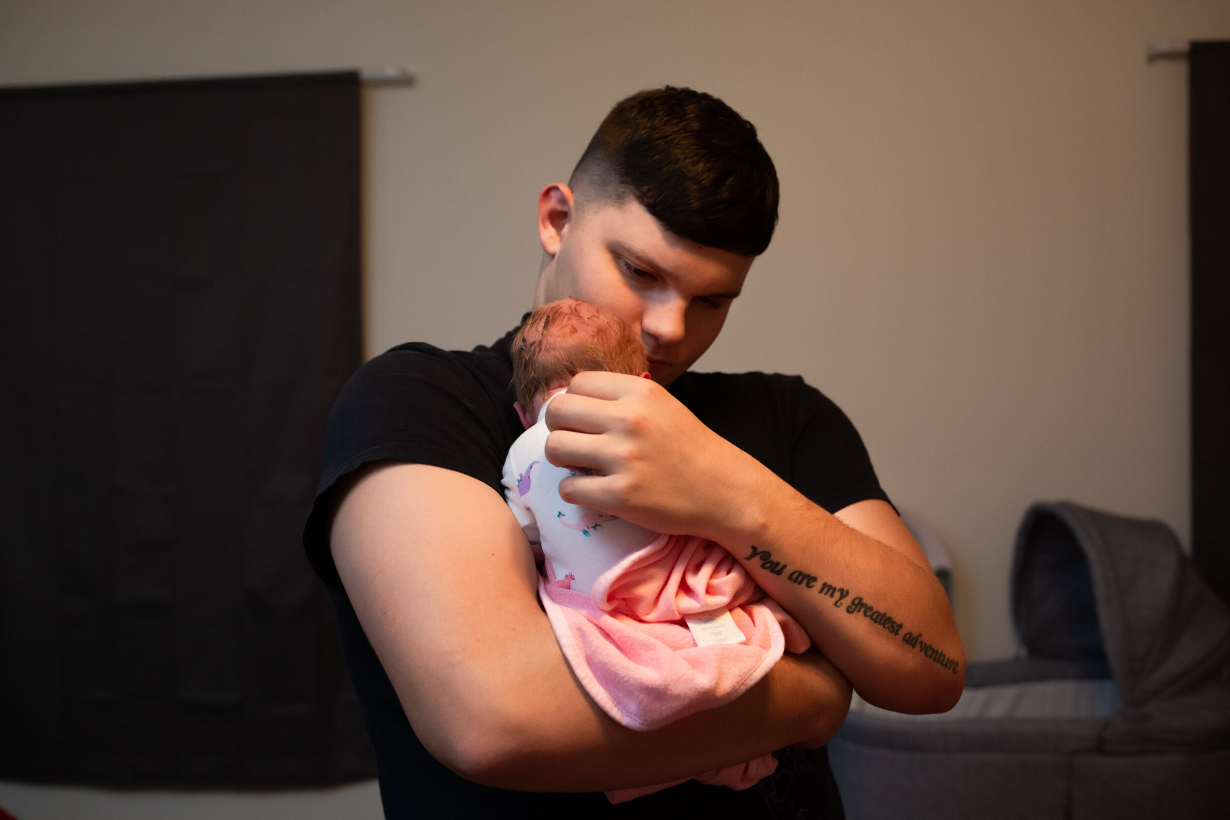new dad holding his baby girl