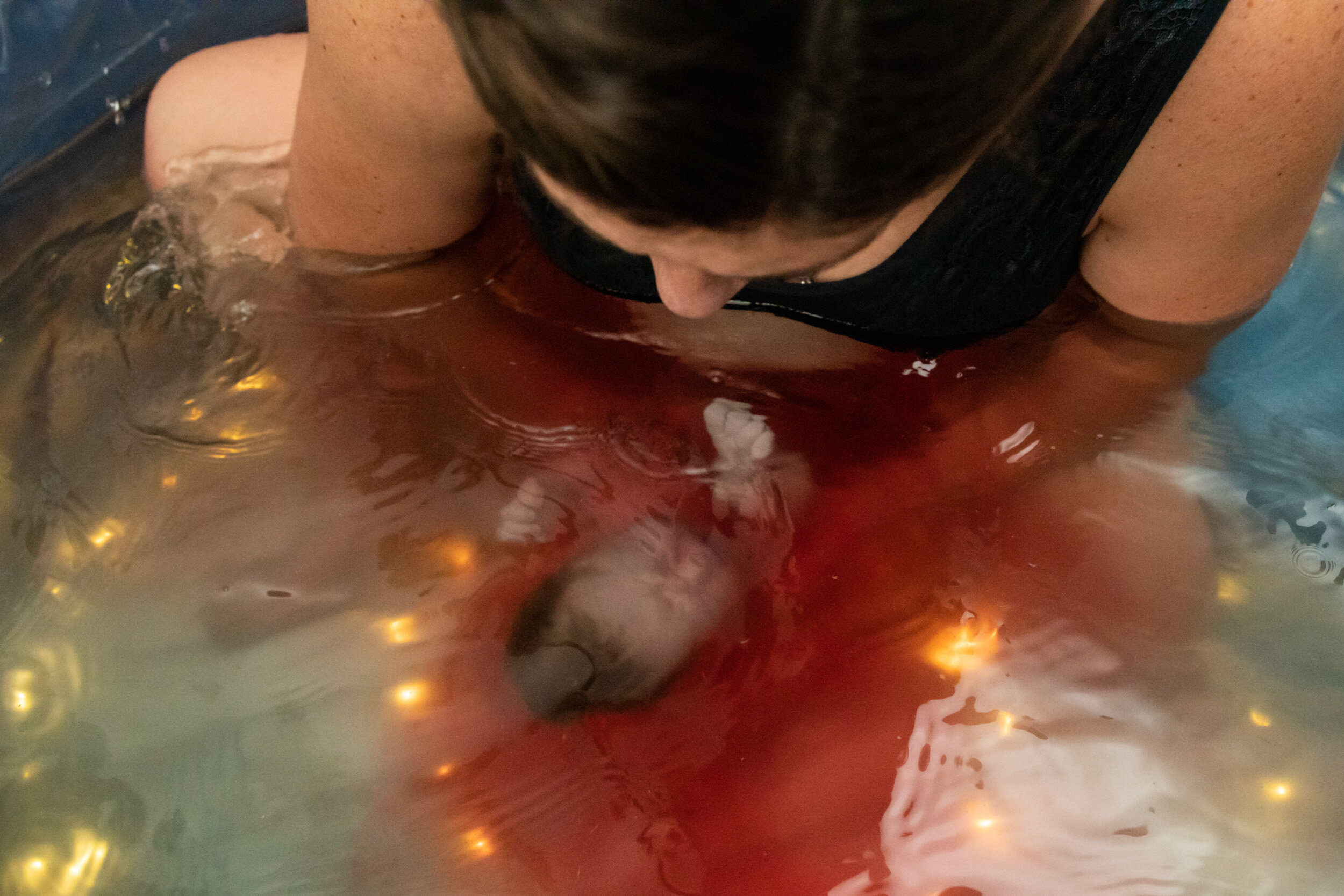 baby being born in water