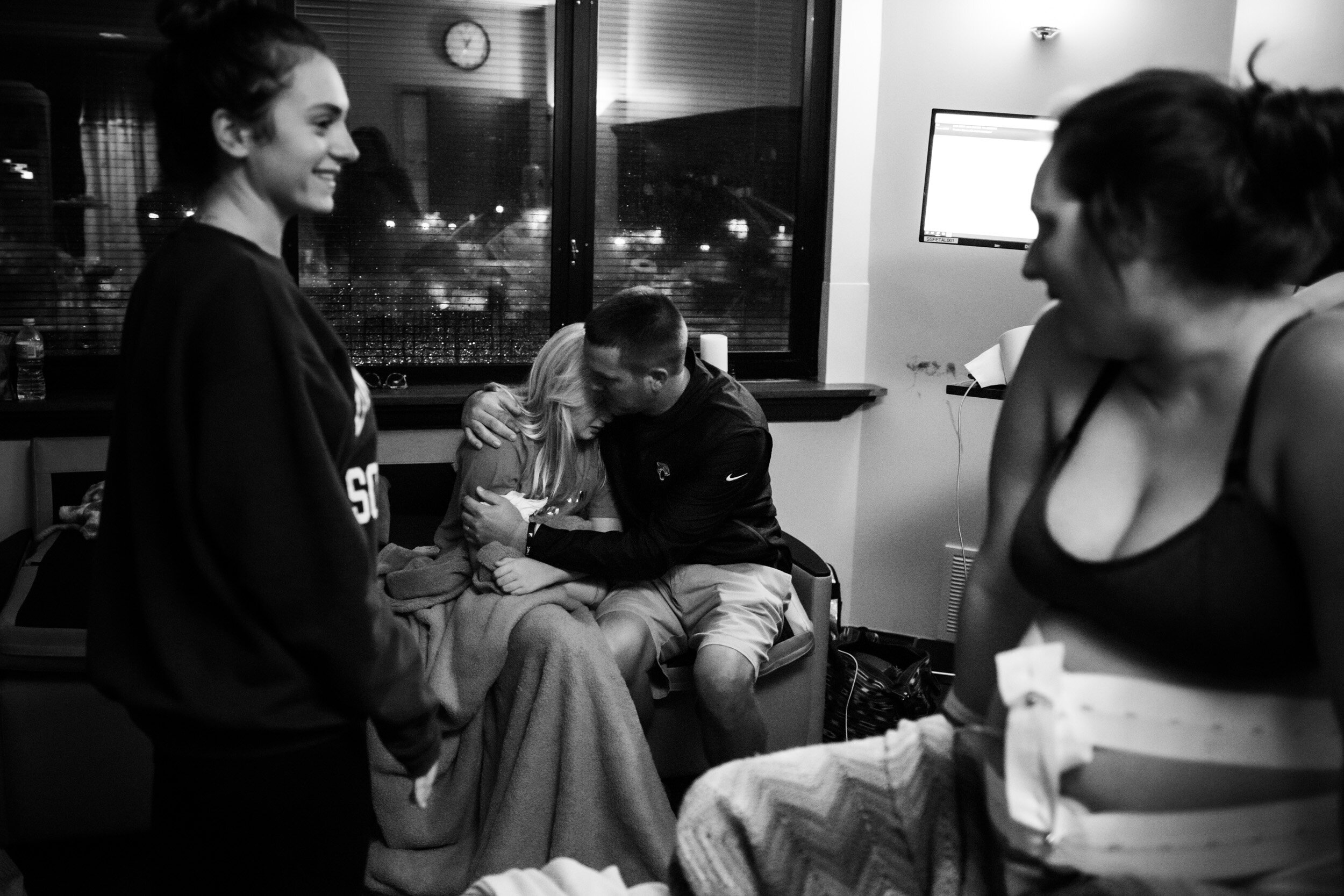 dad comforting his daughter who was crying during mom's labor