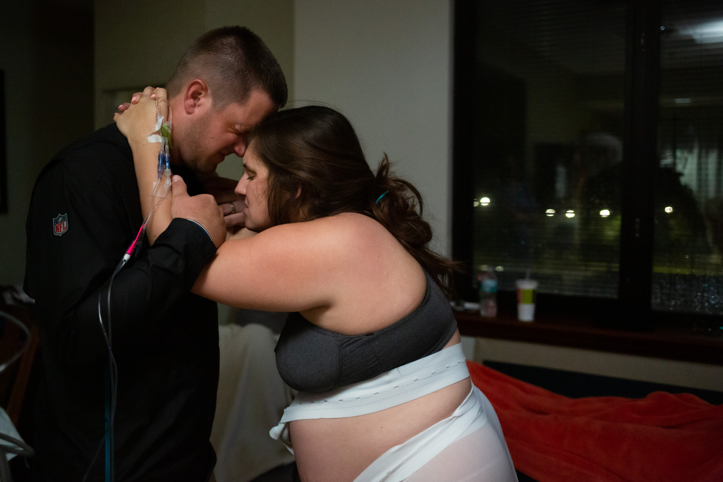 pregnant mom being supported in labor by her husband