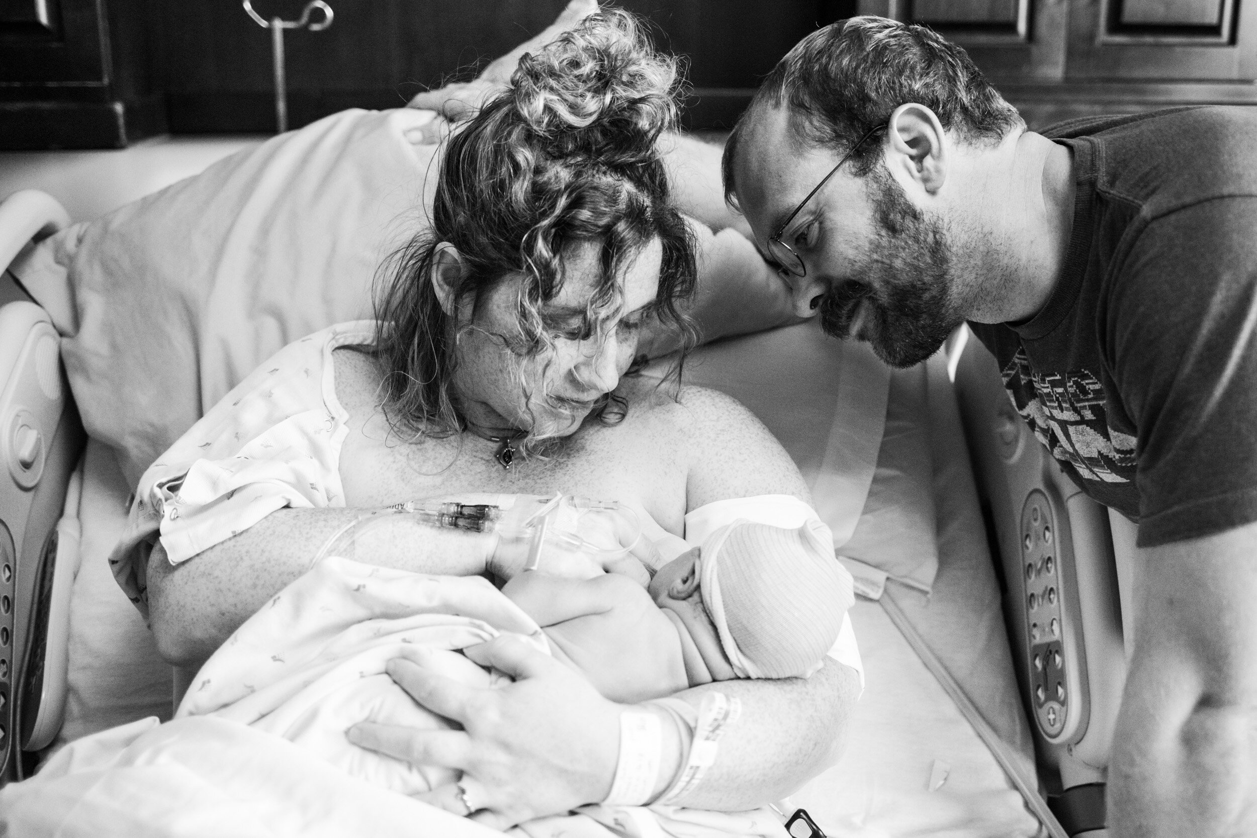 jacksonville parents admiring their newborn baby just after birth