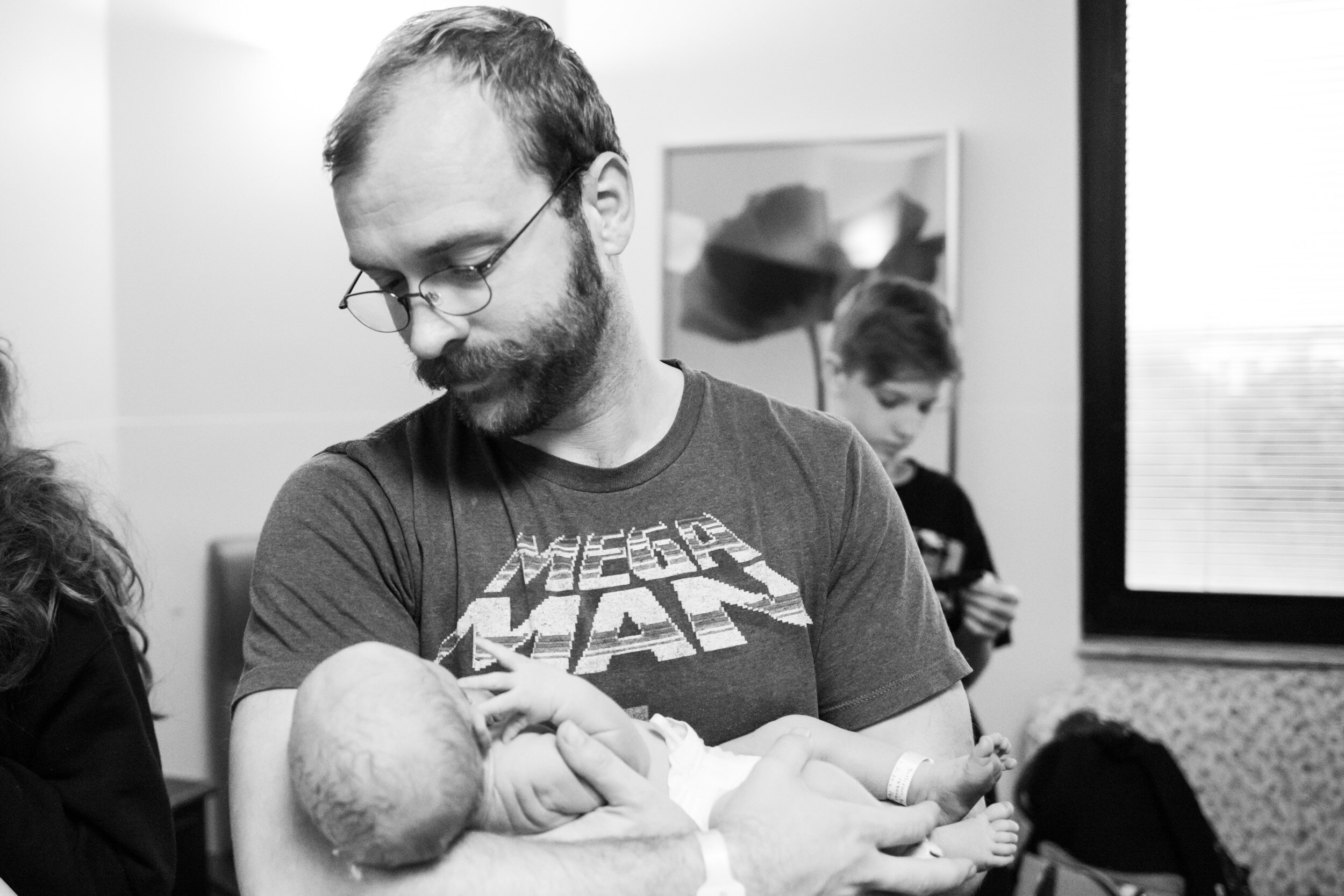 jacksonville dad holding newborn baby boy