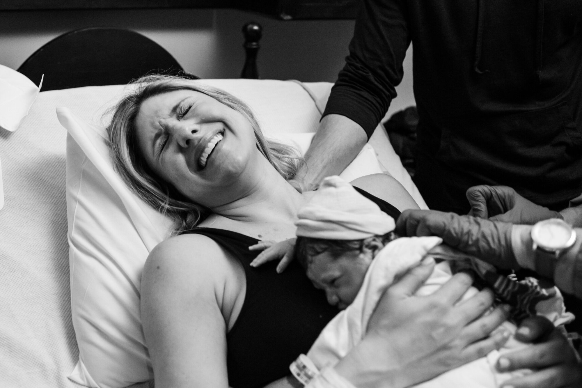 jacksonville mom laughing with joy after baby is born
