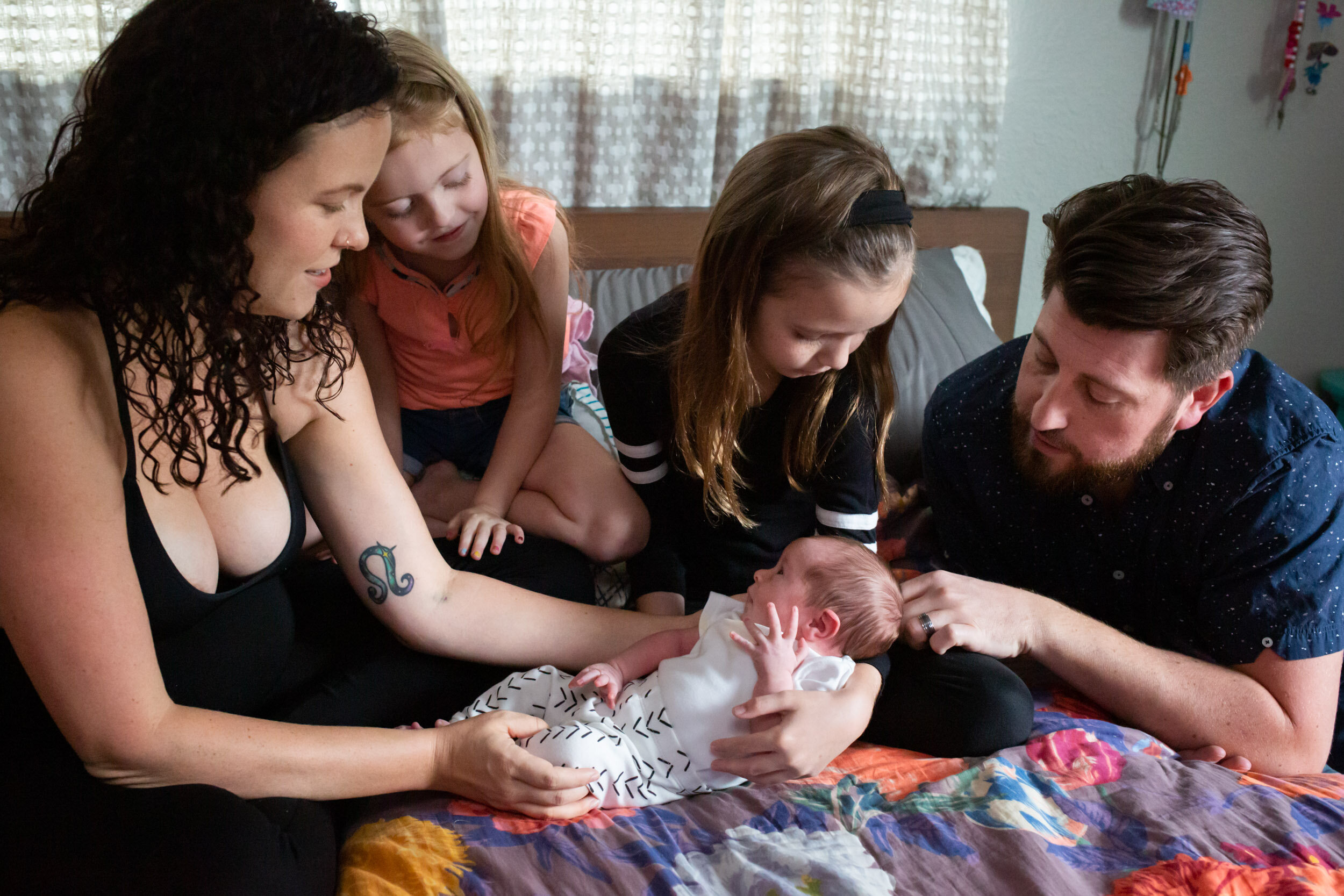jacksonville family looks at newborn baby girl