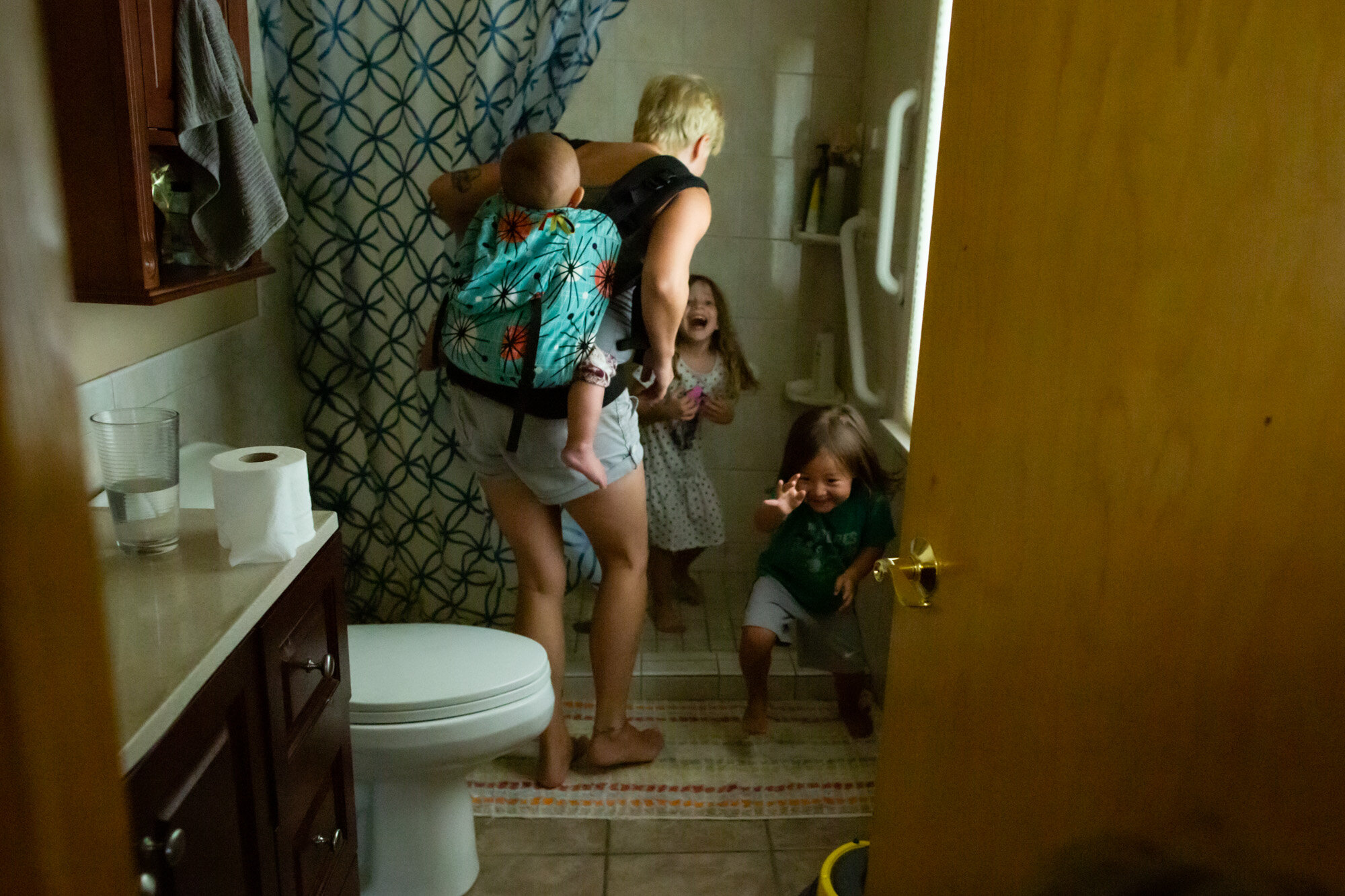 mom chasing children who were hiding in the shower