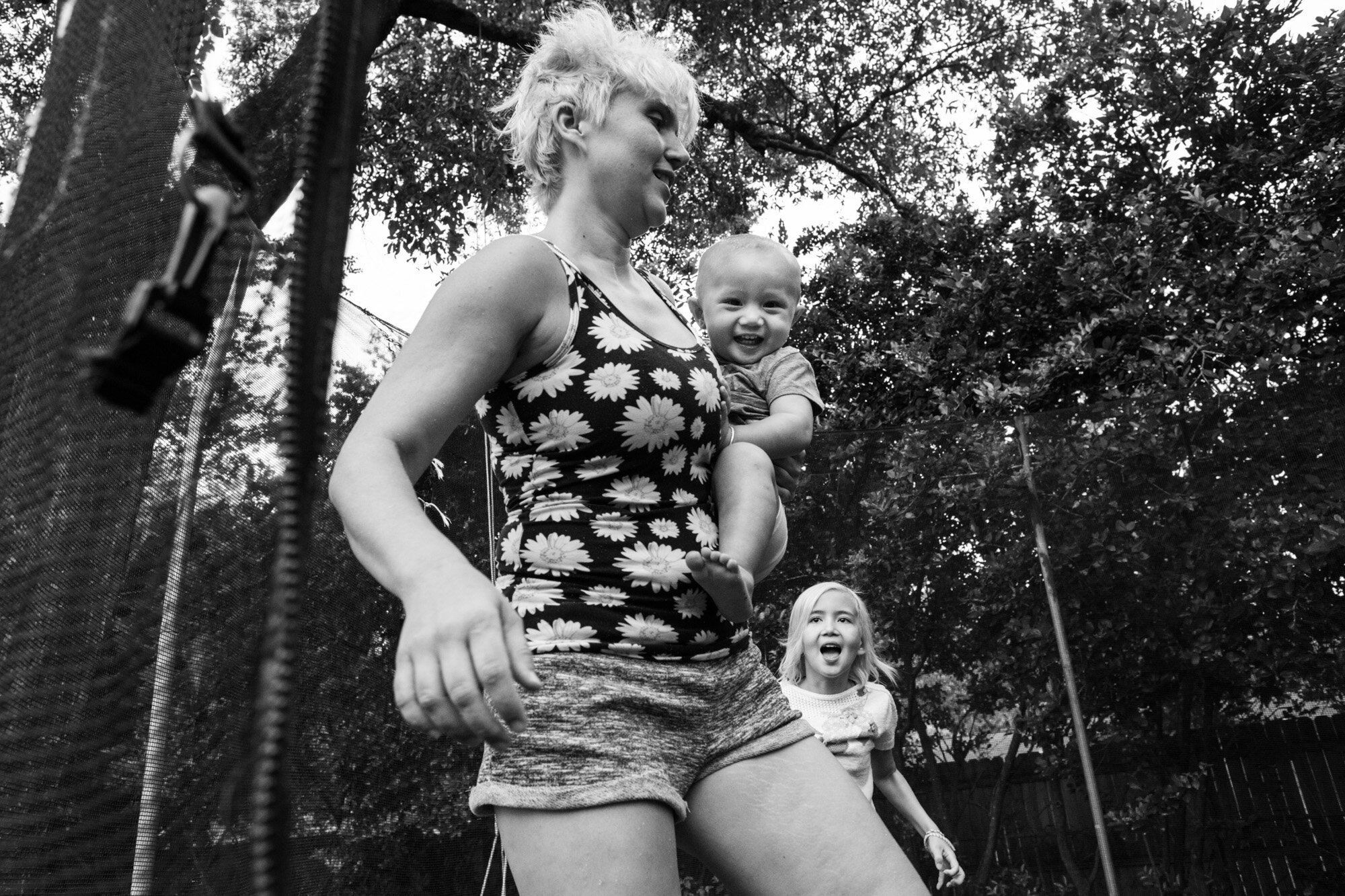 gainesville mom enjoying trampoline with her baby