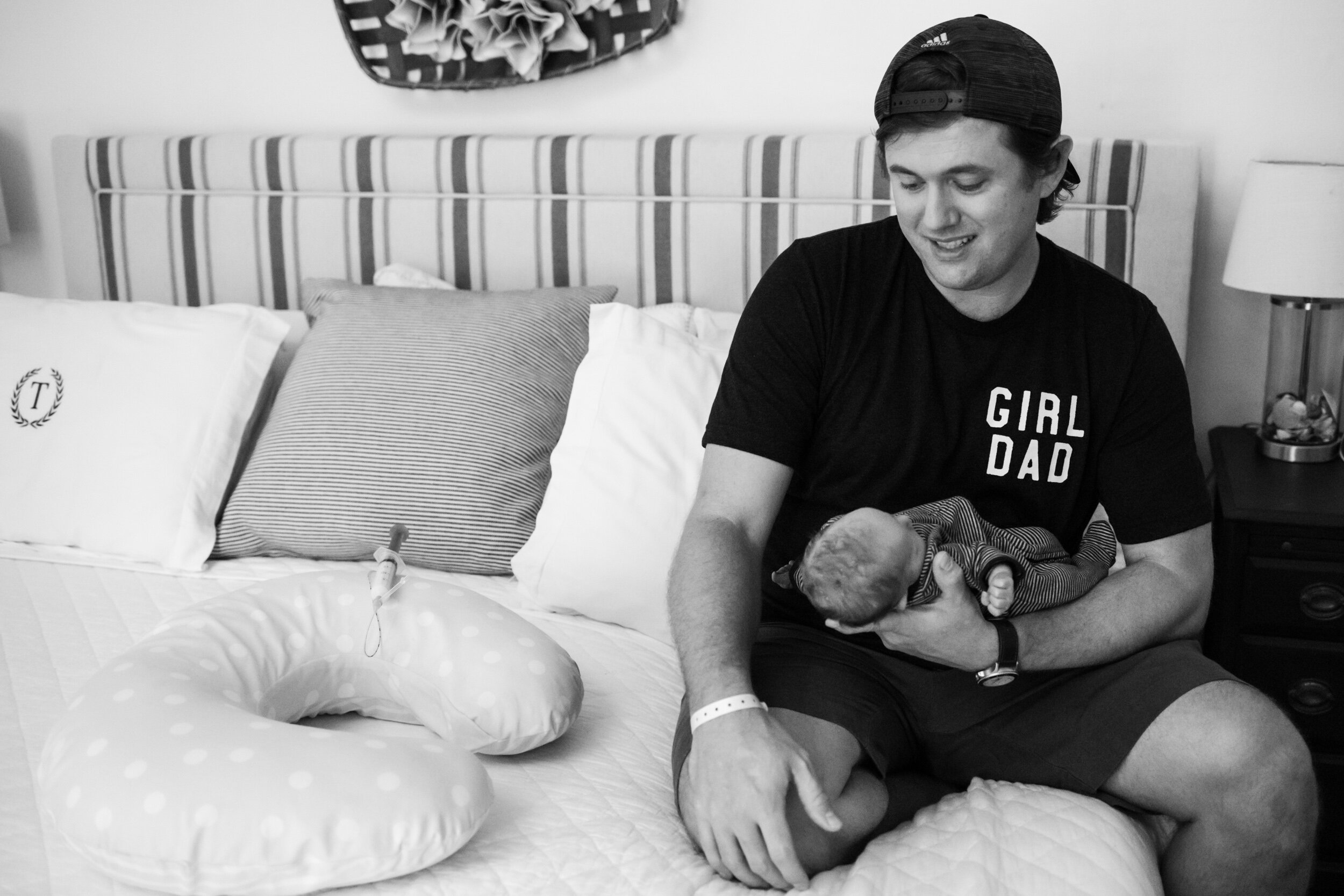 dad holding newborn baby girl