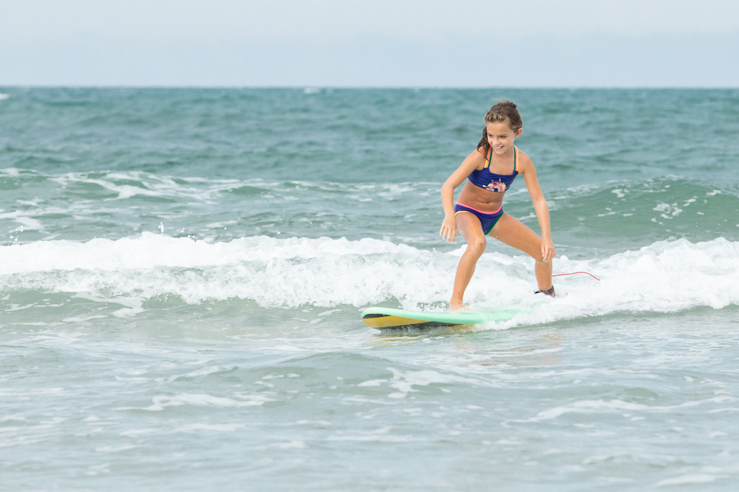 girl surfing at anastasia island