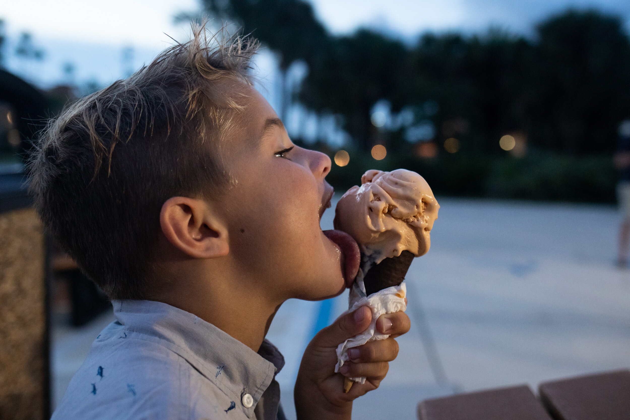little boy licking his ice cream cone