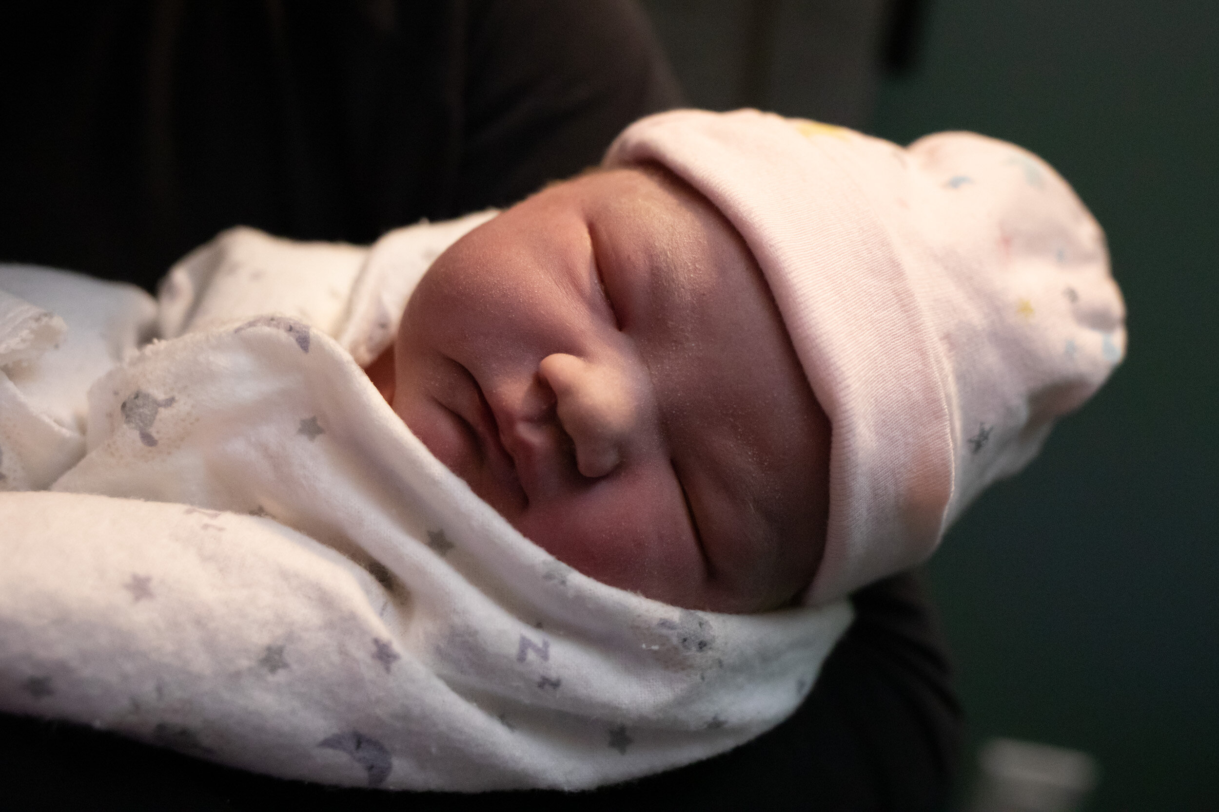 Newborn baby girl all wrapped up, just after birth at Transitions Birth Center in Jacksonville