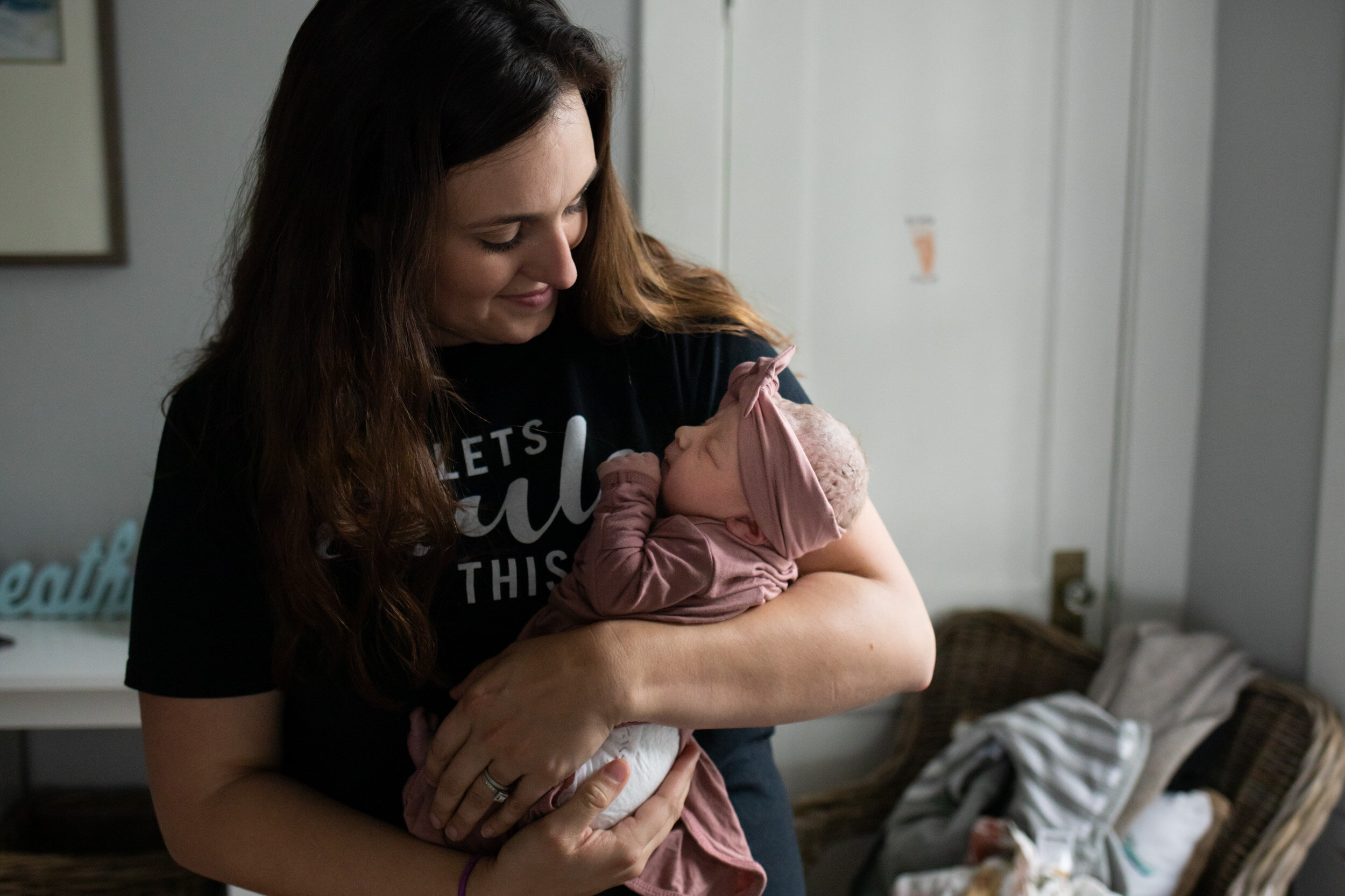 Doula Kahla holding baby girl just after birth